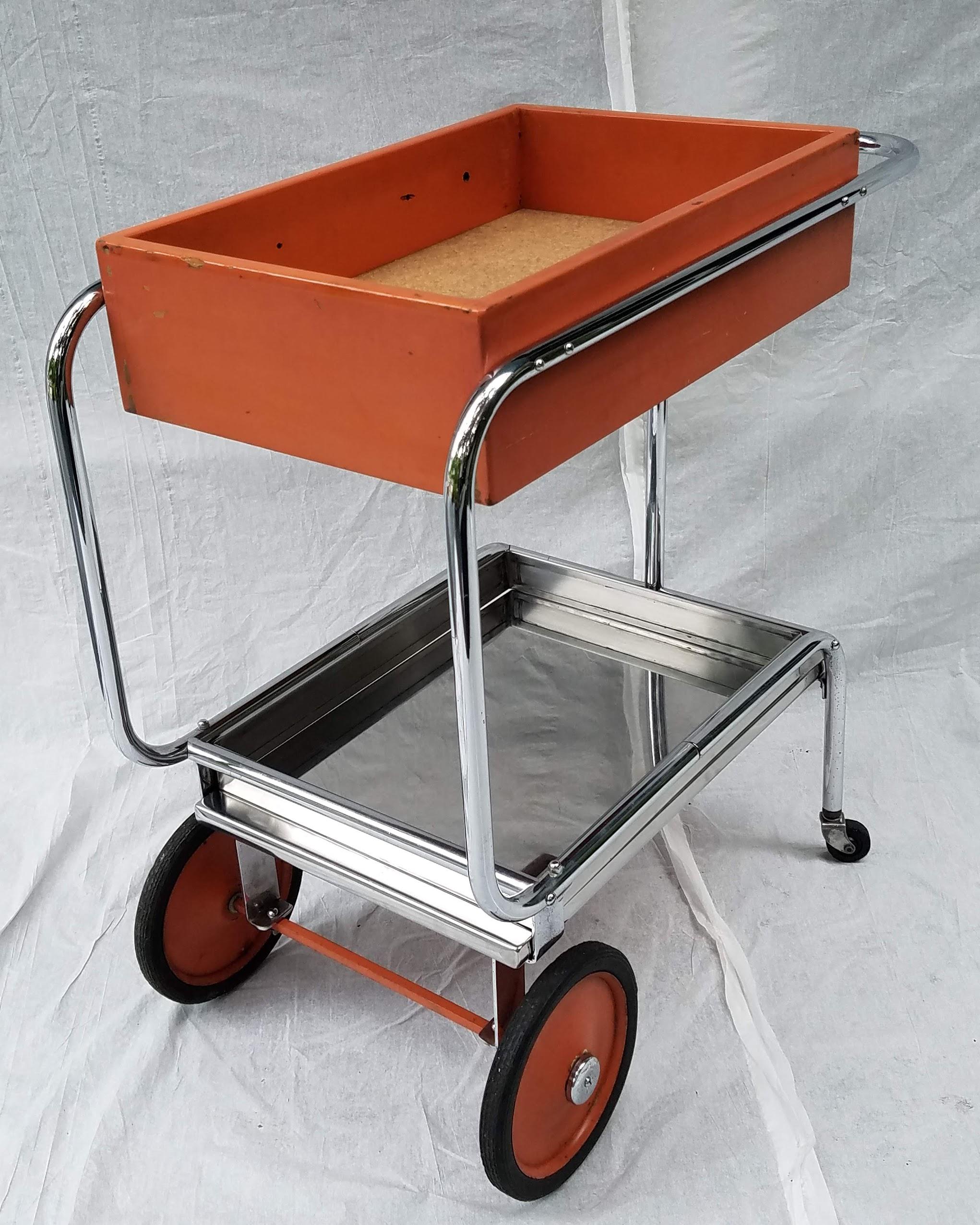 Rolling chrome bar cart designed by Gilbert Rohde for Troy Sunshade, circa 1933.
An example can be found in Steve Kenyon's archive of Gilbert Rohde's own magic lantern collection that is available on Flickr