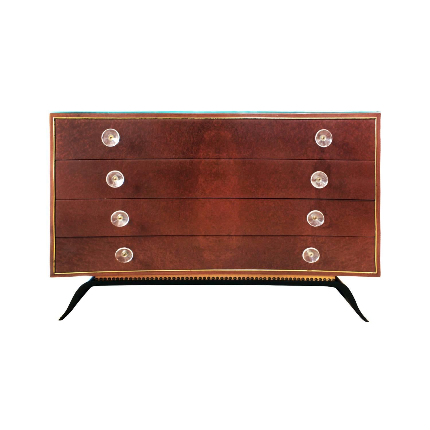 Elegant chest of drawers no. 3920 in East India rosewood and Sequoia burl with leather trim with custom glass top designed by Gilbert Rohde for Herman Miller, American 1939. (
