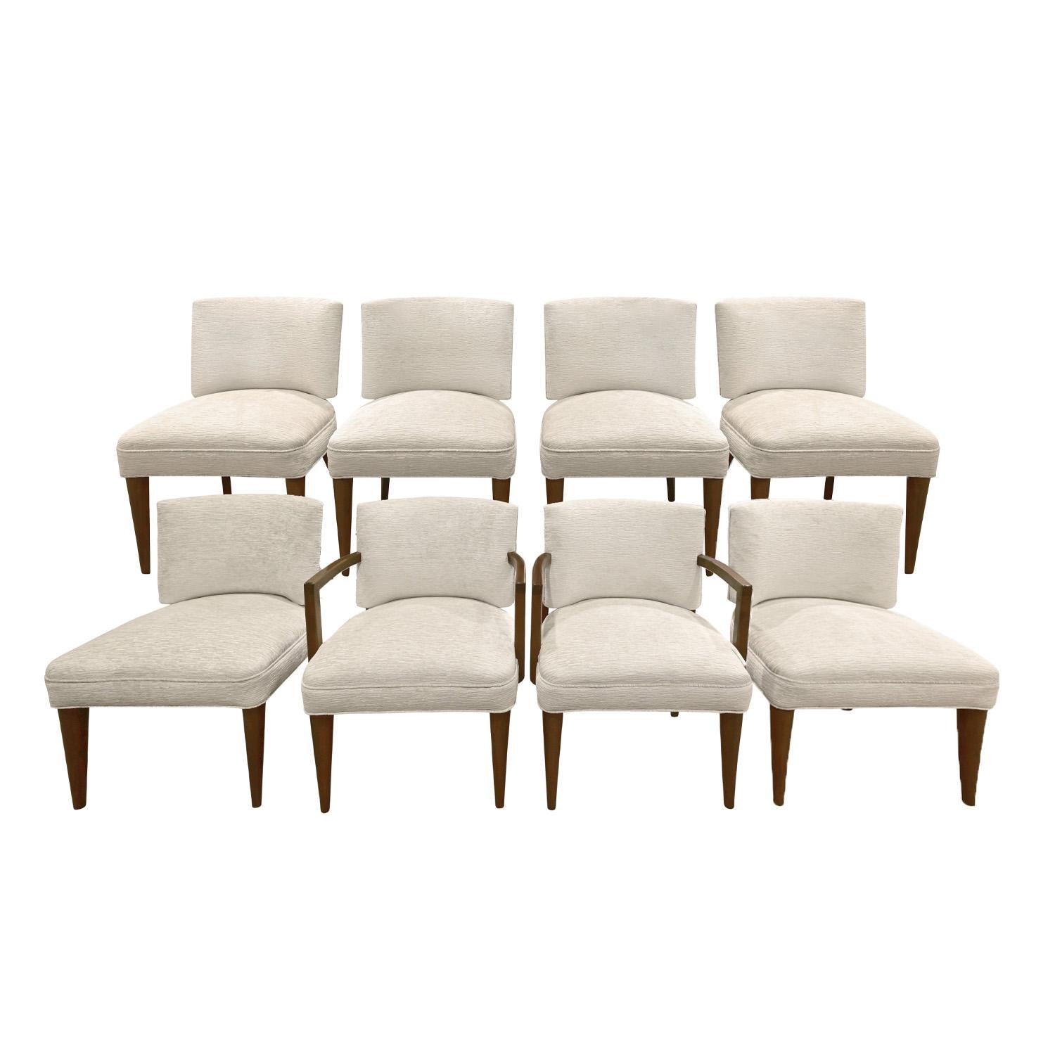 Set of 8 elegant upholstered dining chairs model  (2 arm chairs model No. 4196 and 6 side chairs model No. 4195), legs and arms in dark Pacific walnut with beautifully curved backs, by Gilbert Rohde for Herman Miller, Paldao Group, American 1940's. 