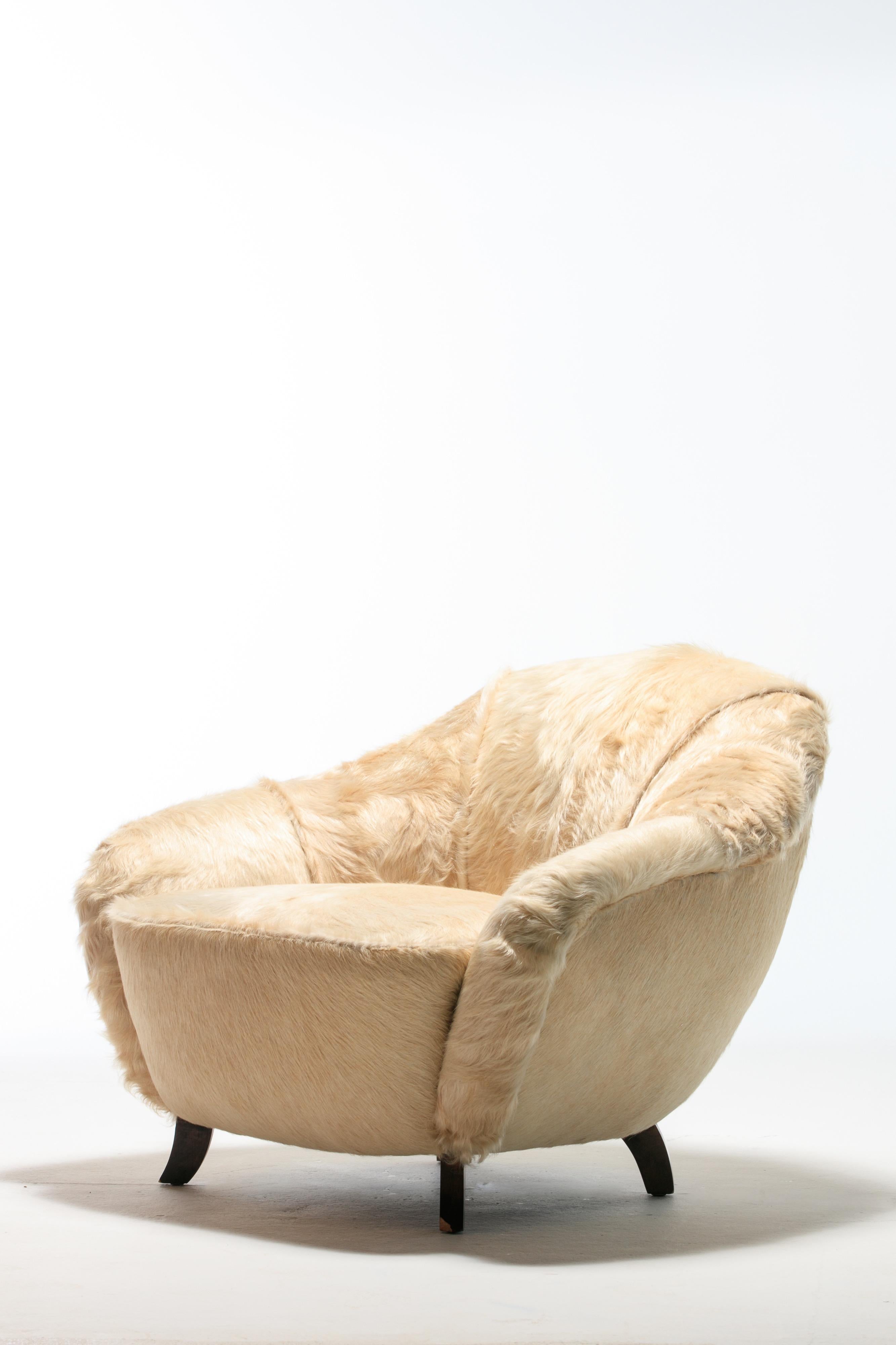 Luxuriously reupholstered in rich champagne tone Brazilian cowhides, this 1930s lounge chair designed by Gilbert Rohde for Herman Miller - Easy Chair model number 3950 - was featured in photos in Chicago's Herman Miller Showroom as early as 1939.