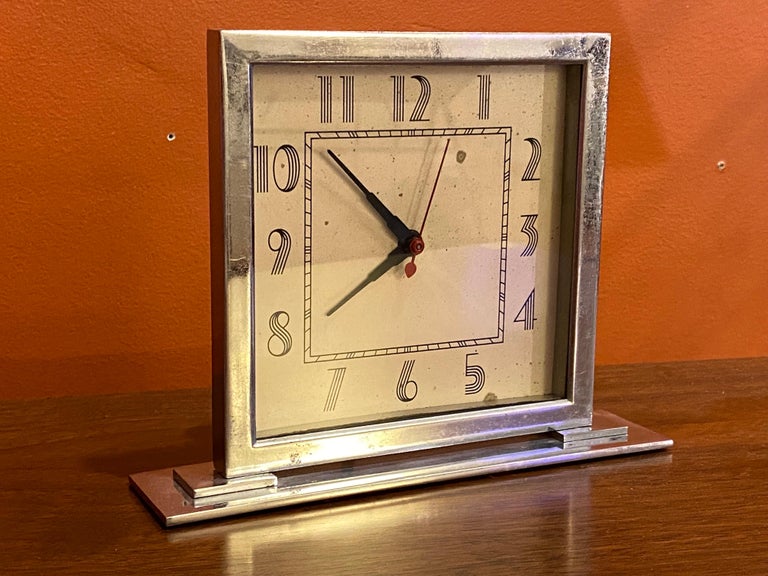 Gilbert Rohde for Herman Miller table or desk clock. Clock has the less common face version with the numbers made up of curving lines. Clock is all original! Chrome shows typical wear, face has a couple marks as well as seen in photos. Very reliable