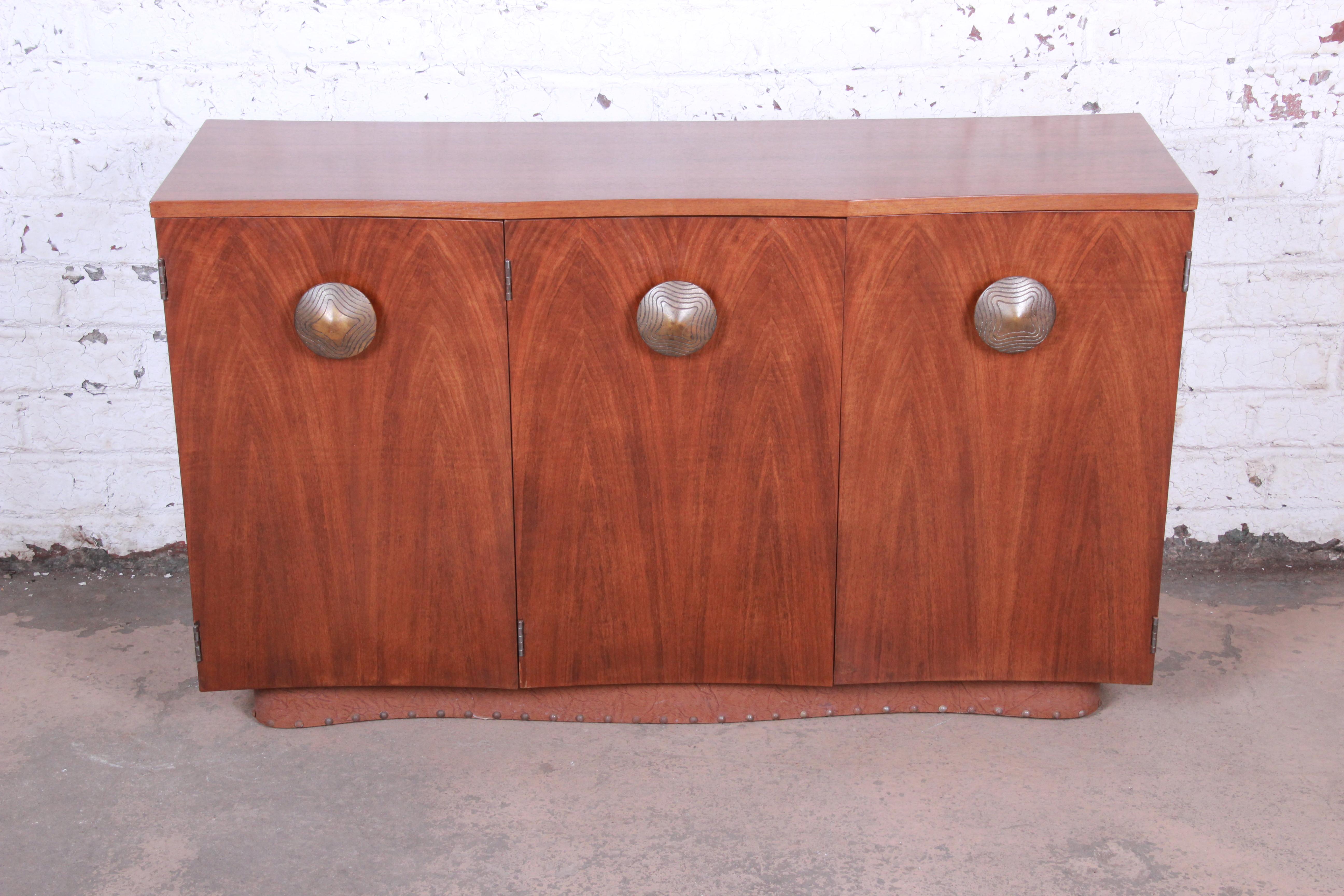 A rare and exceptional Mid-Century Modern sideboard credenza or bar cabinet

Designed by Gilbert Rohde for Herman Miller 