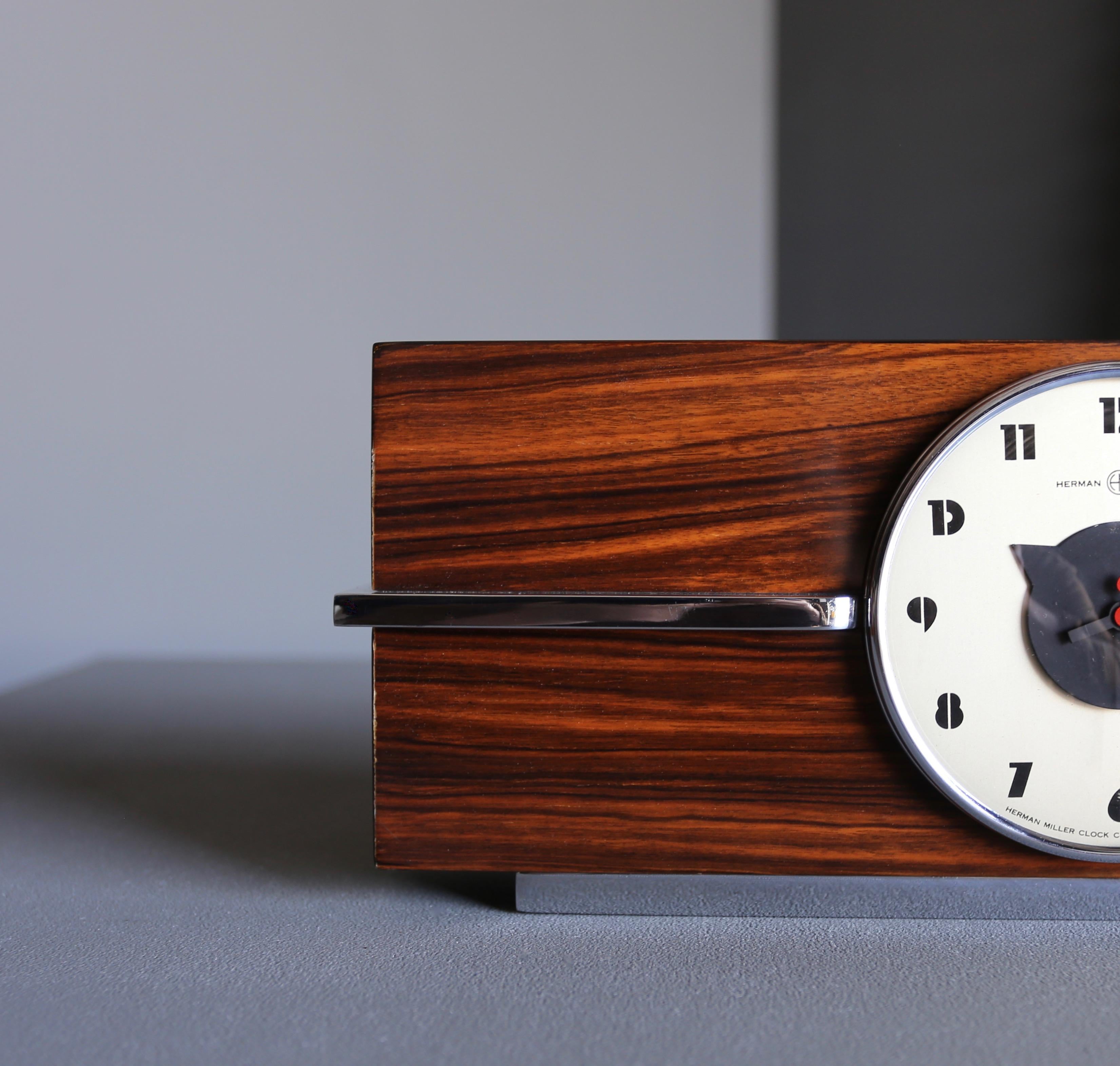 Gilbert Rohde Macassar ebony table clock, no. 6366 for Herman Miller, circa 1940.
 
 