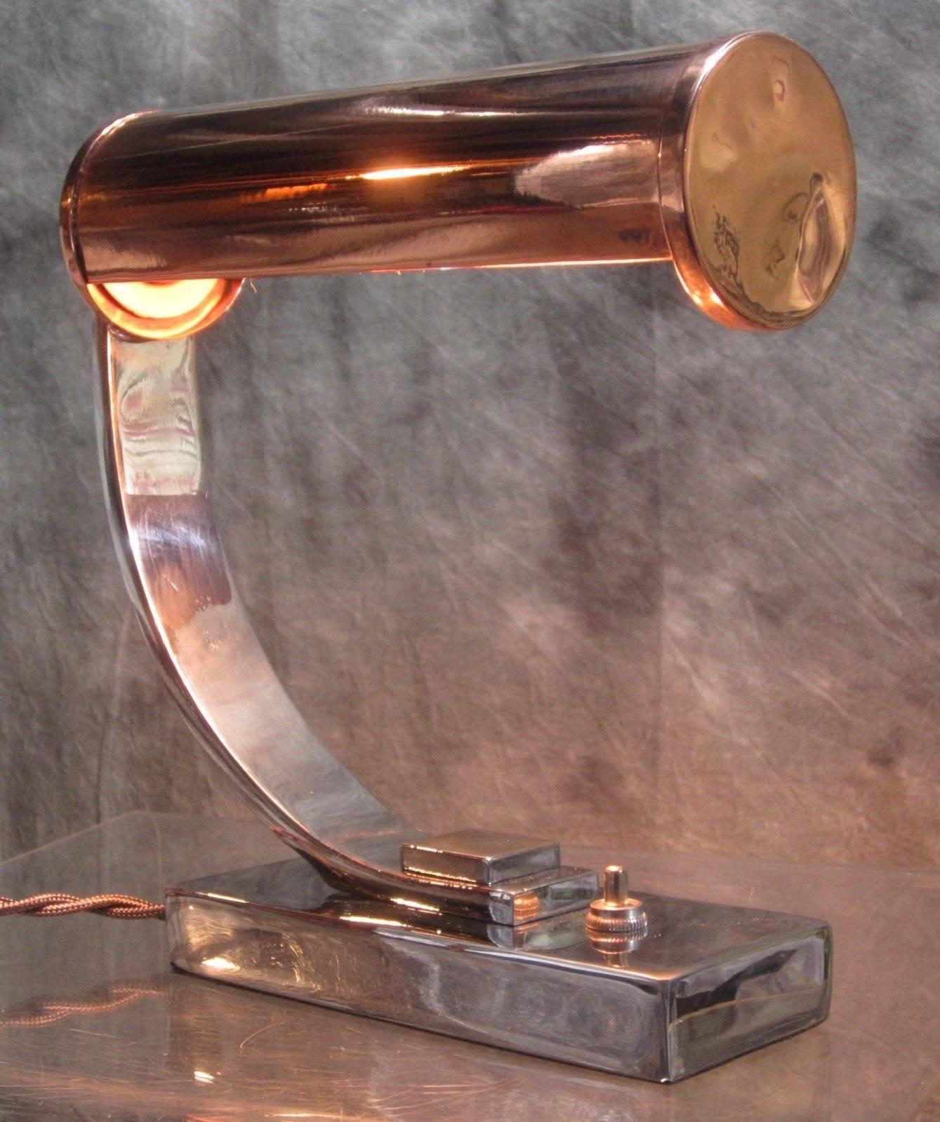 Restored decorative Art Deco lamp attributed to celebrated designer, Gilbert Rohde. This original lamp has been sought after by collectors and has been included in books on Machine Age, Streamline and Industrial Design.

Original bakelite socket