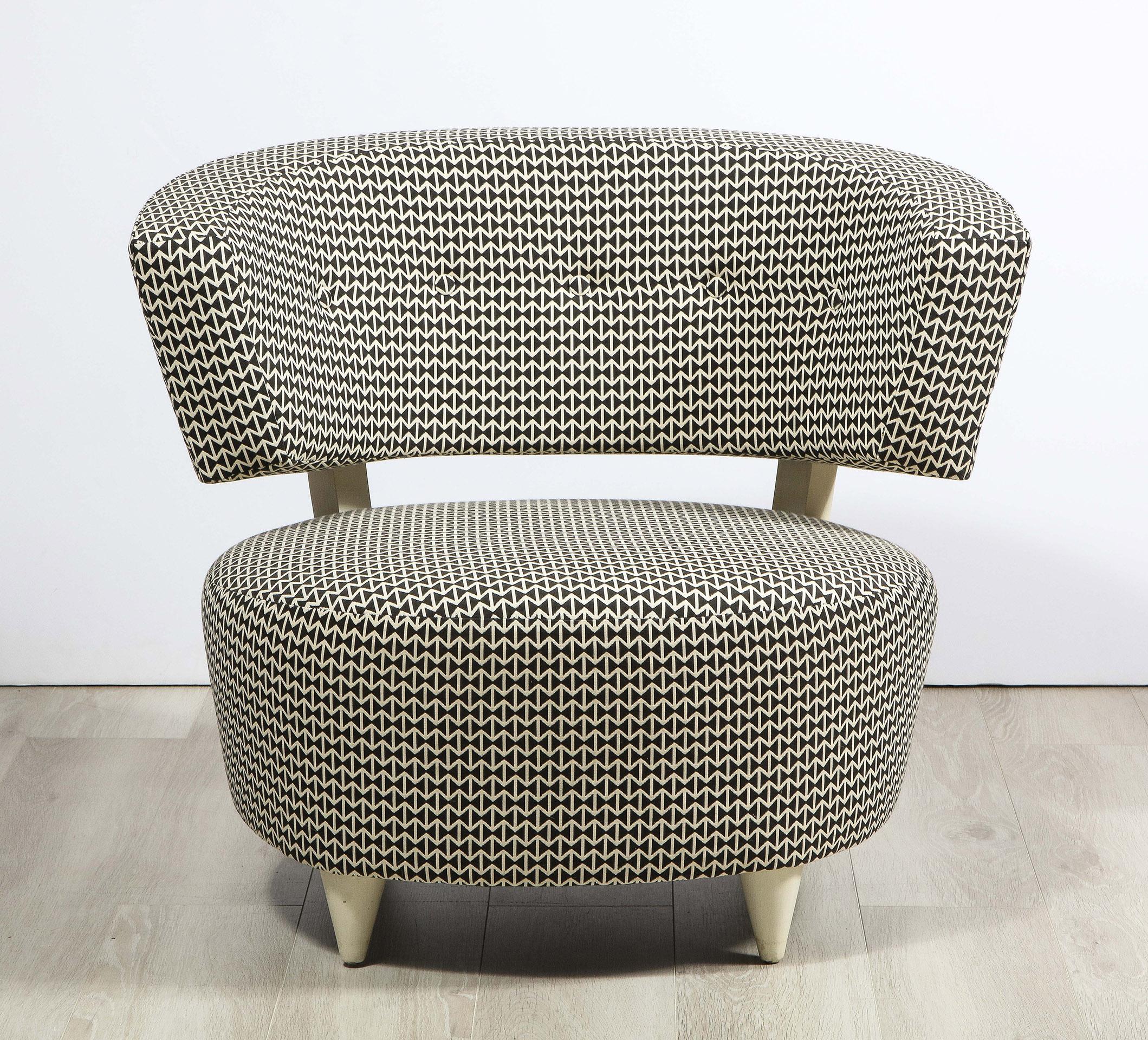 The Gilbert Rohde slipper chair designed for Herman Miller, having an upholstered round seat supporting a separate upholstered back all on four turned legs. 
 