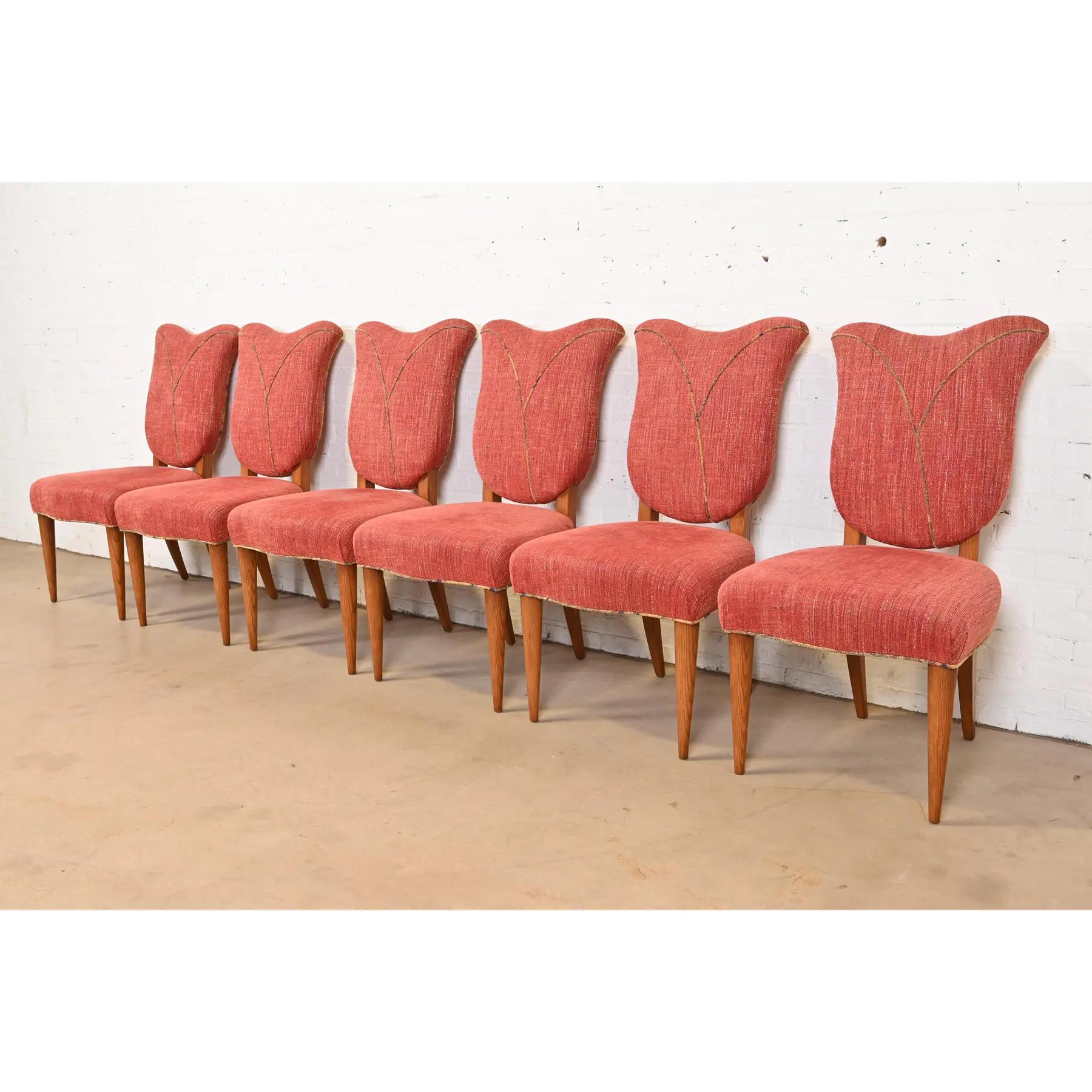 An outstanding set of six Art Deco or Mid-Century Modern tulip form dining chairs

In the manner of Gilbert Rohde

USA, 20th Century

Solid oak frames, with upholstered seats and backs.

Measures: 21.75