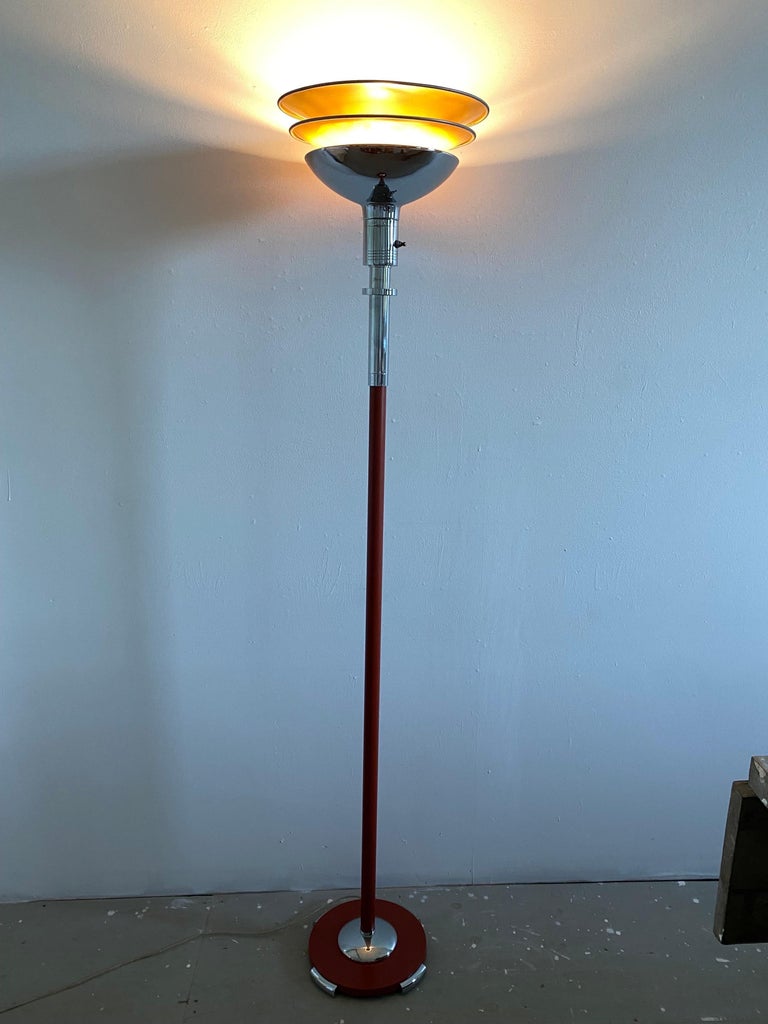 Gilbert Rohde Torchiere for Mutual Sunset Lamp Company. Nice example in the harder to find Rusty Red Color! Retains it's original light brown color to the aluminum reflector top shade. Chrome has been redone at some point, all looks very good except