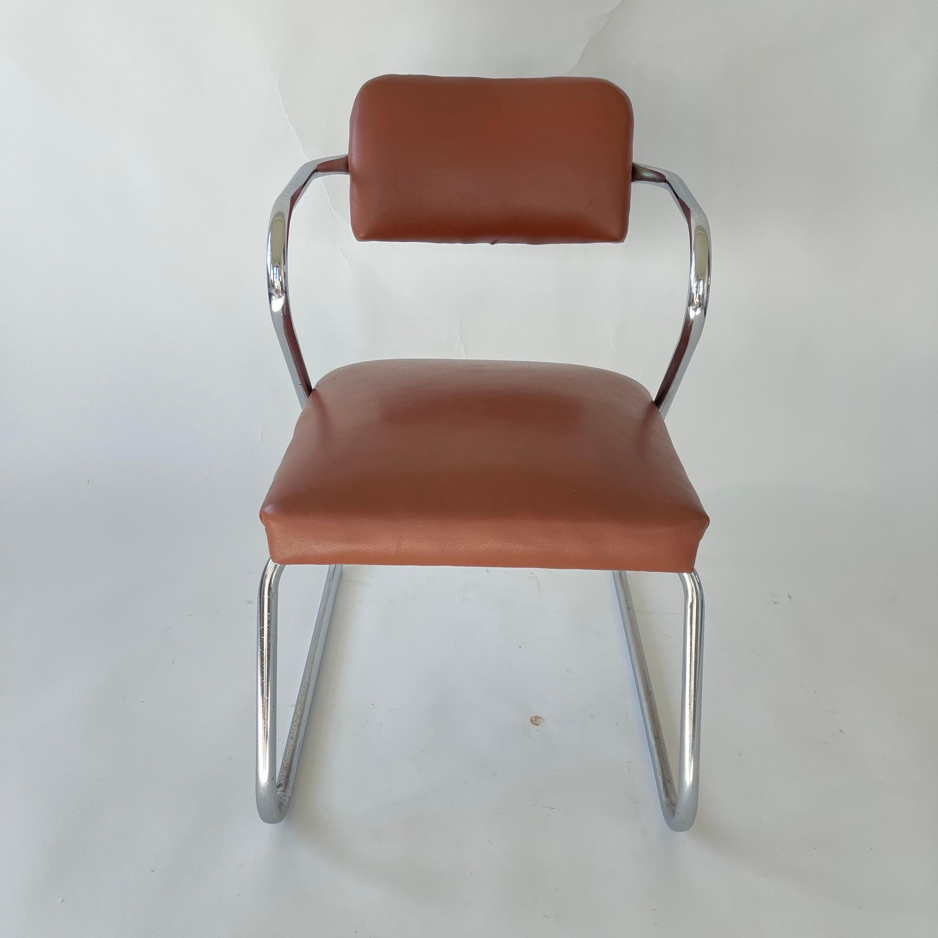 Iconic streamline Art Deco Z chair, rendered in a tubular chrome plated bent steel frame with cognac leather seat and back, with nail head detail.  Designed by Gilbert Rohde for Troy Sunshade Company, USA, 1930s.