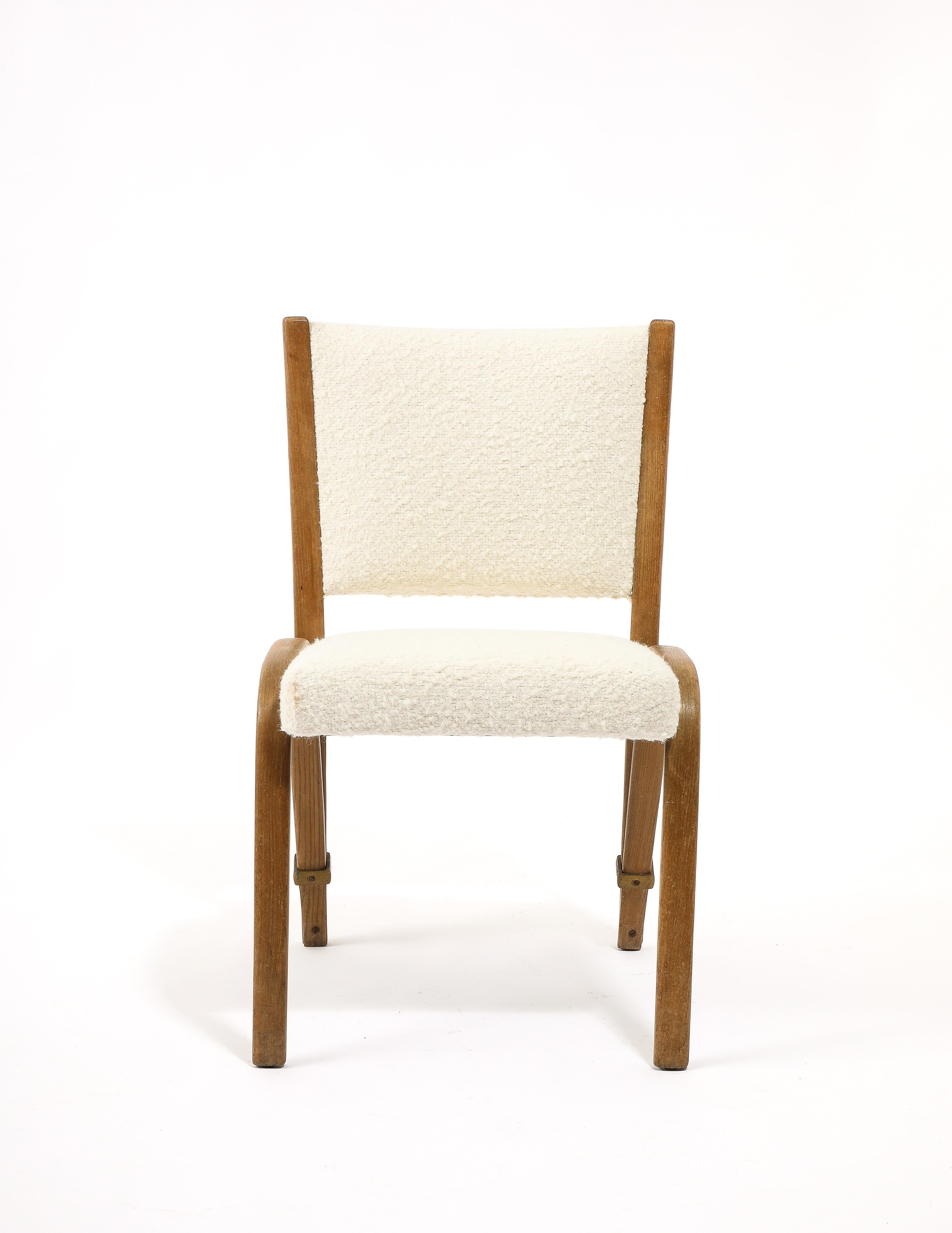Bent oak dining chair by Gilbert Steiner with an elegant construction and a flexible back with brass hardware. 12 available priced as singles.
