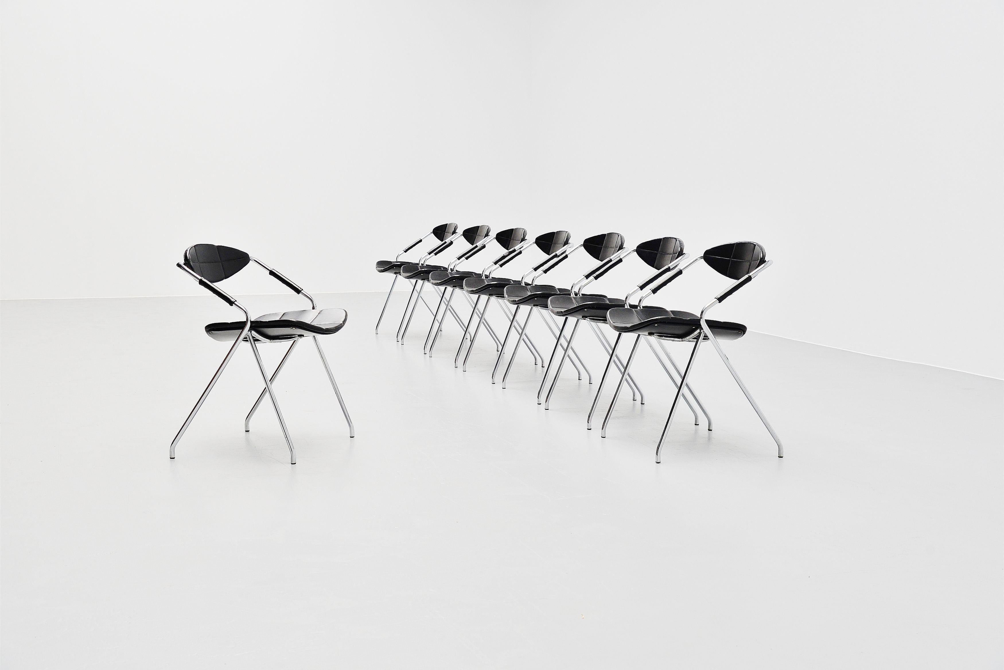 Fantastic set of 8 so called Rugby / Ellipse chairs designed by Gilbert Steiner and manufactured by Steiner, France 1962. These chairs have chrome plated tubular metal frames and very nice high quality leatherette black seats. The chairs are