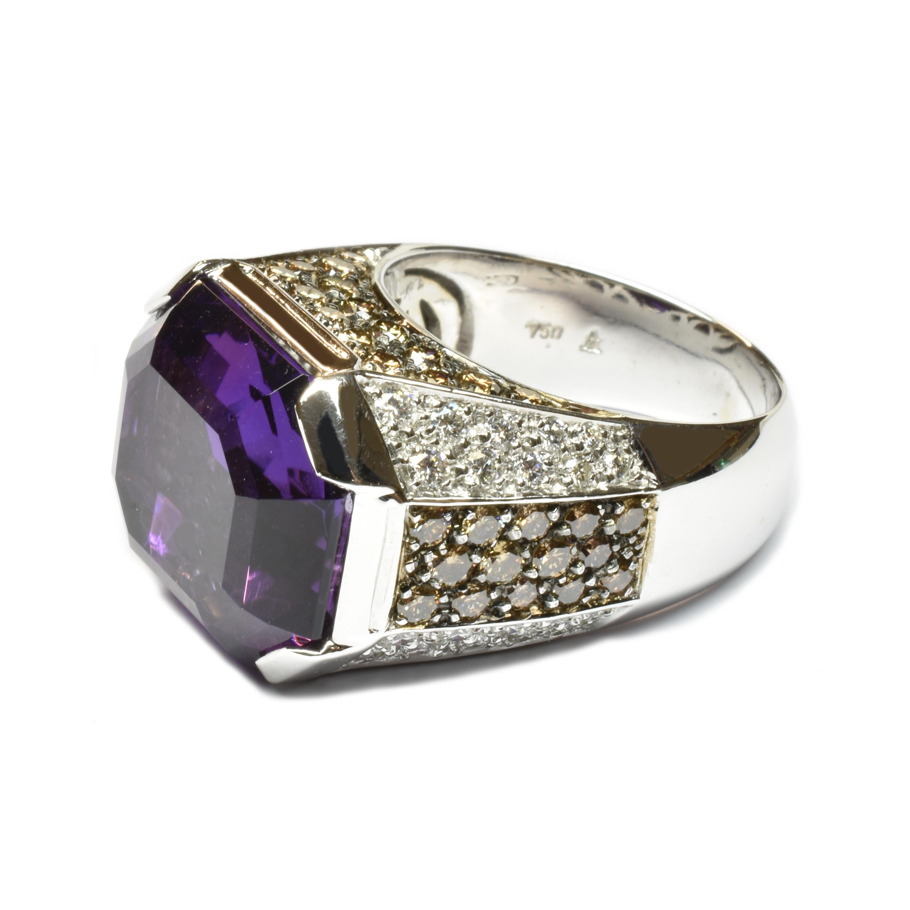 Gilberto Cassola 18Kt White Gold Ring with Octagonal Shaped Amethyst and White and Champagne Diamonds.
Octagonal Shaped Amethyst sized mm 16x14for a Weight of ct 12.11
Champagne Diamonds are set on Black Rhodium Plated 18Kt Gold.
A Classy and