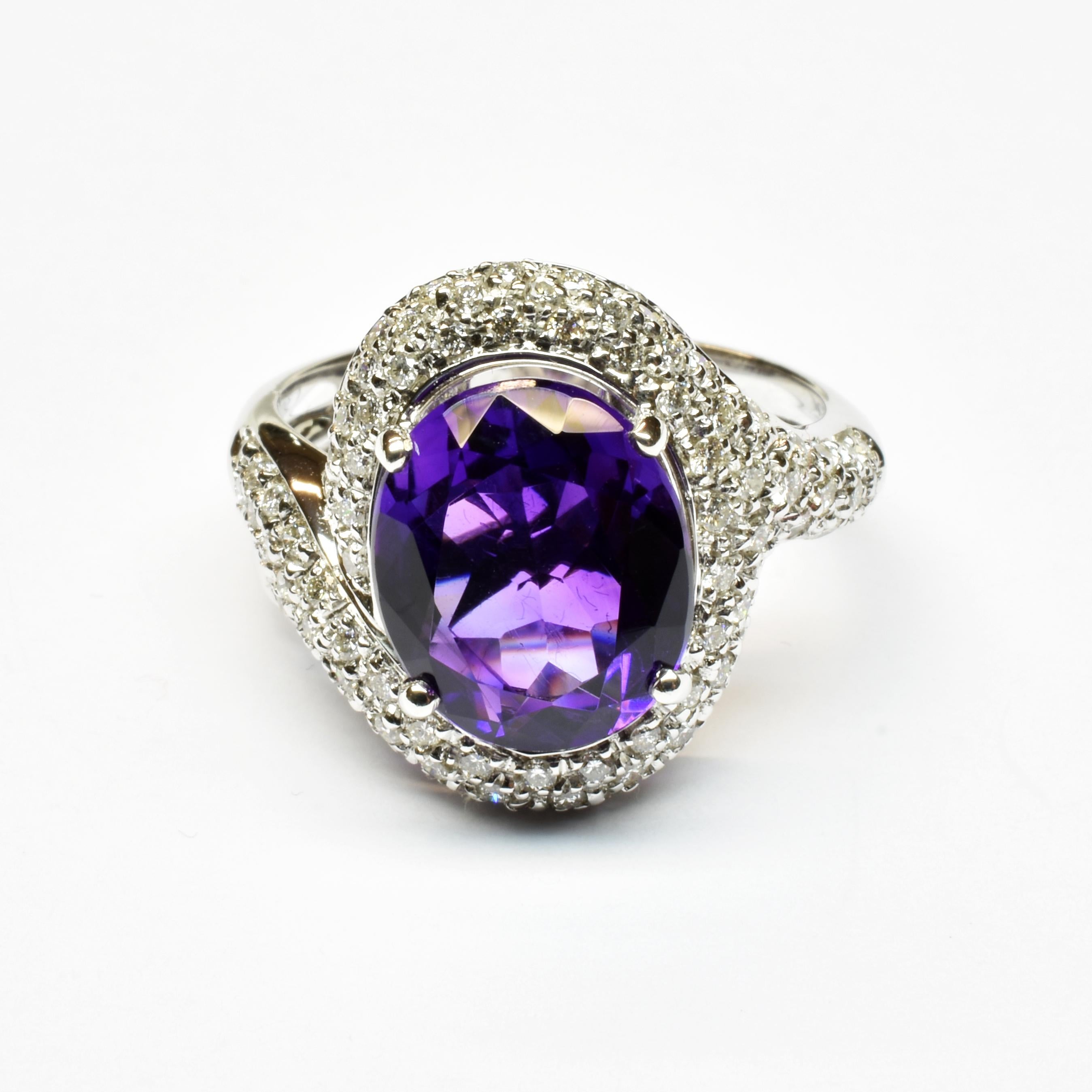 Gilberto Cassola 18Kt White Gold Ring with Oval Shaped Brilliant Cut Amethyst and Diamonds.
Handmade in our Atelier in Valenza Italy.
Oval Brilliant Cut Amethyst mm 12x10 for a weight of ct 5.50. 
G Color Vs Clarity White Diamonds ct 0.95.
18Kt