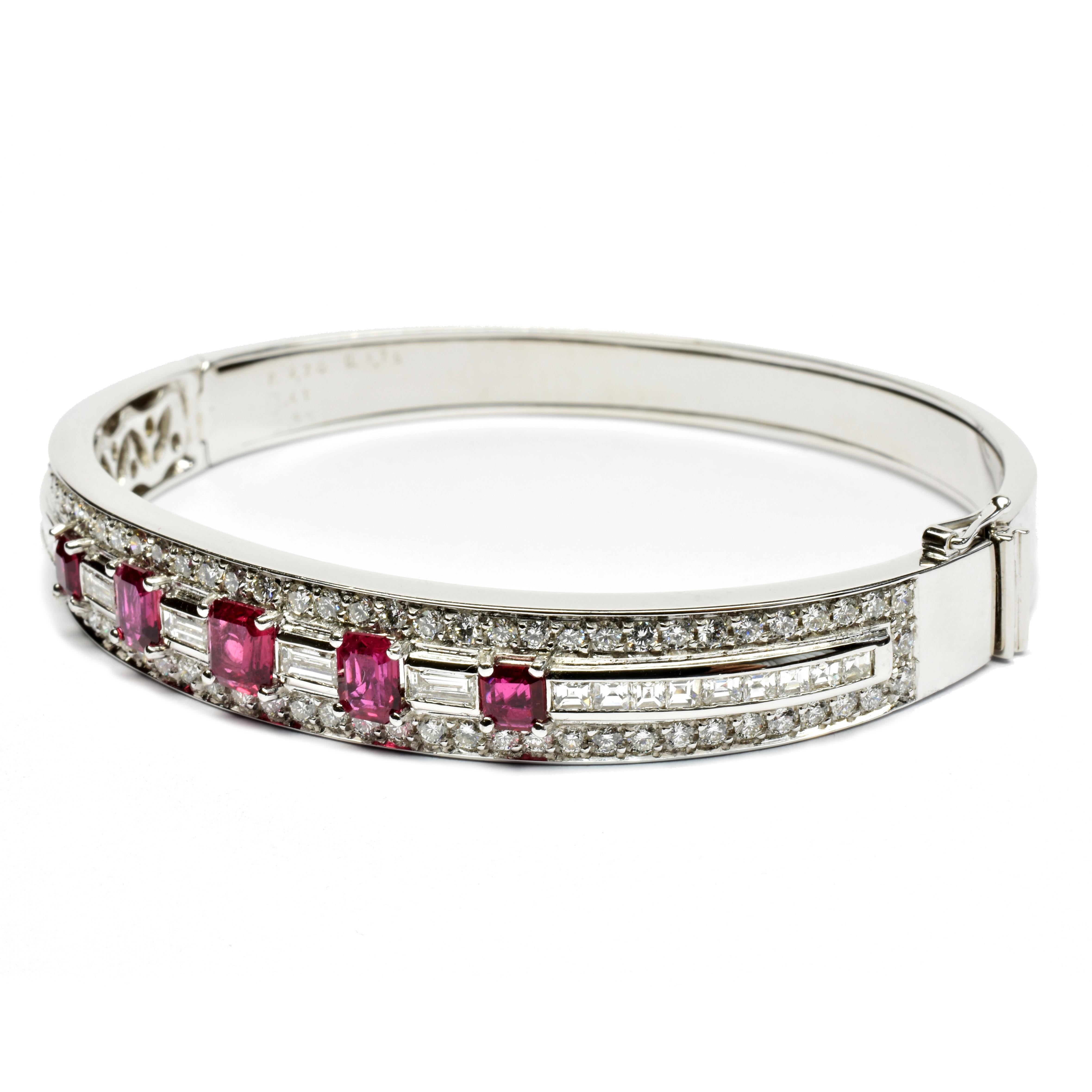 18 Kt White Gold Unique Bangle Bracelet with Octagonal Rubies,  Baguette and Round Diamonds.
One of a Kind Piece, Handmade in our Atelier in Valenza Italy.
Very Clean and Bright Rubies. 
Top quality craftmanship with a very clean and exquisite
