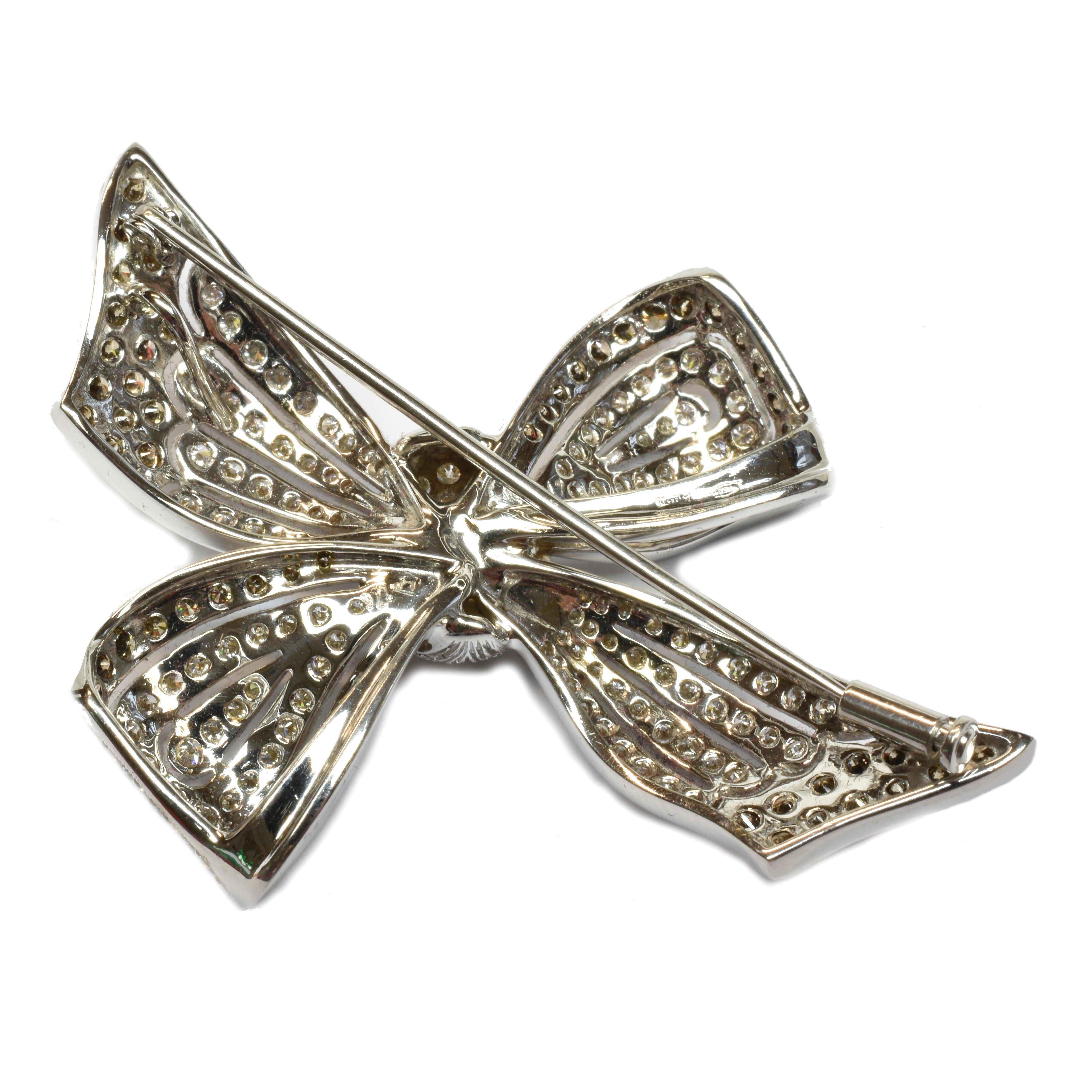 18Kt White Gold Bow Brooch with White and Champagne Diamonds.
One of a Kind Piece. Handmade in our Atelier in Valenza Italy.
This Big and Unique Bow Brooch sports Milgrain Settings for a very elegant timeless look.
Black Rhodium under the Champagne