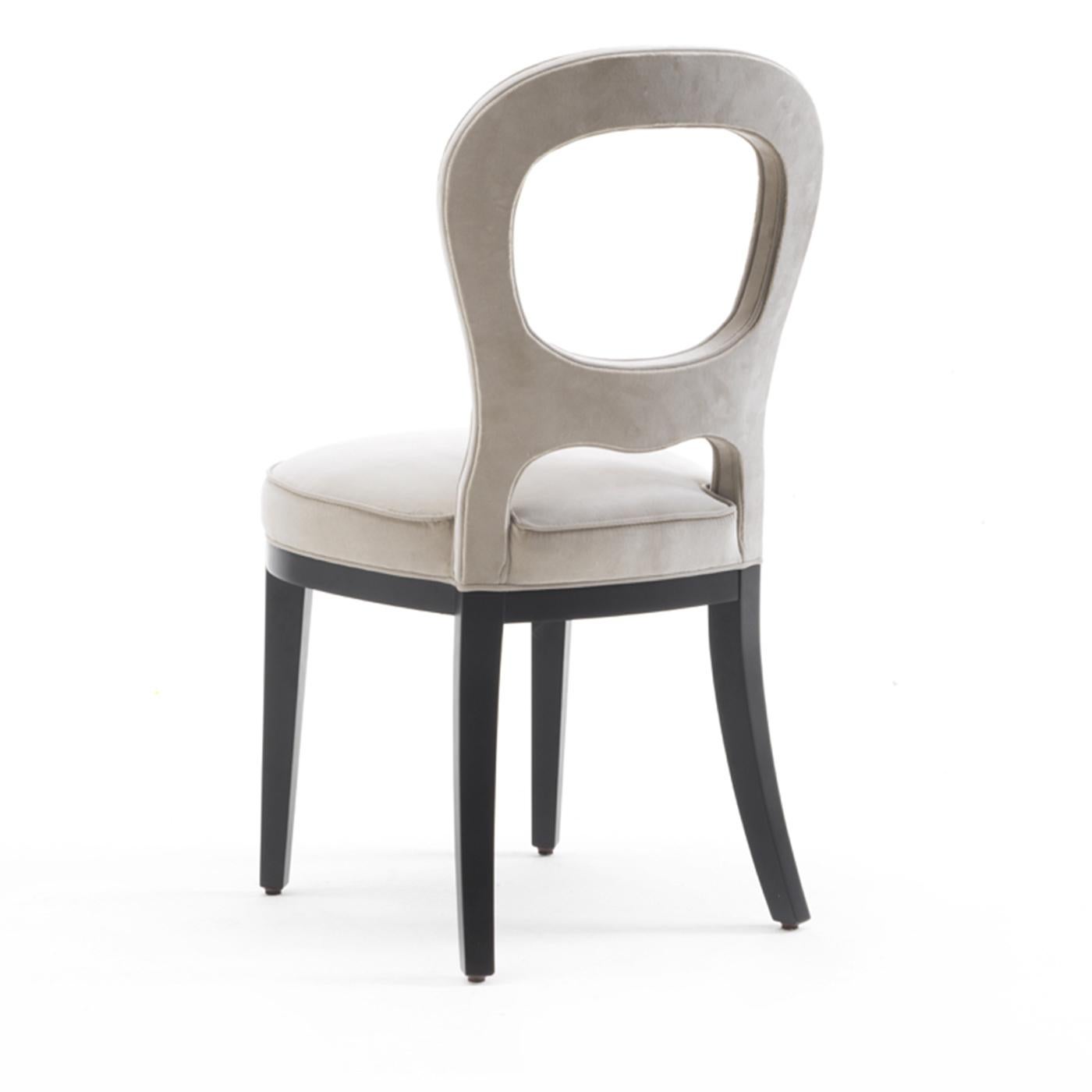 This exquisite chair combines a sinuous silhouette with comfortable seating experience. Either behind a desk in a study, as an accent piece in an entryway or around a dining table, this chair will be a precious addition to both modern and Classic