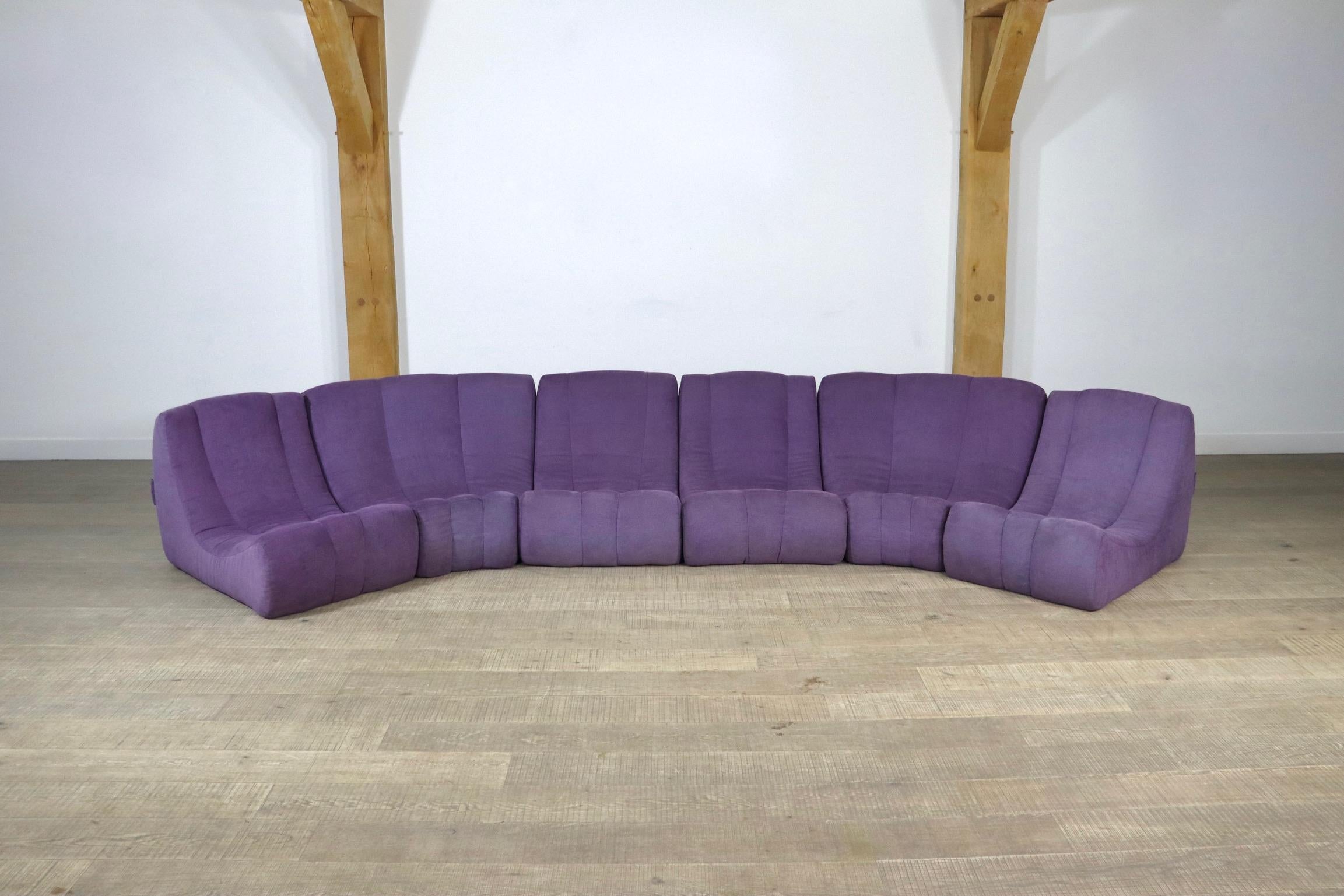 Rare 'Gilda' sofa by Michel Ducaroy made in 1972. This early edition is manufactured by 'Roset', which was the company name of Ligne Roset prior to 1973. The beautiful original purple upholstery fits this groovy design really well. This sofa