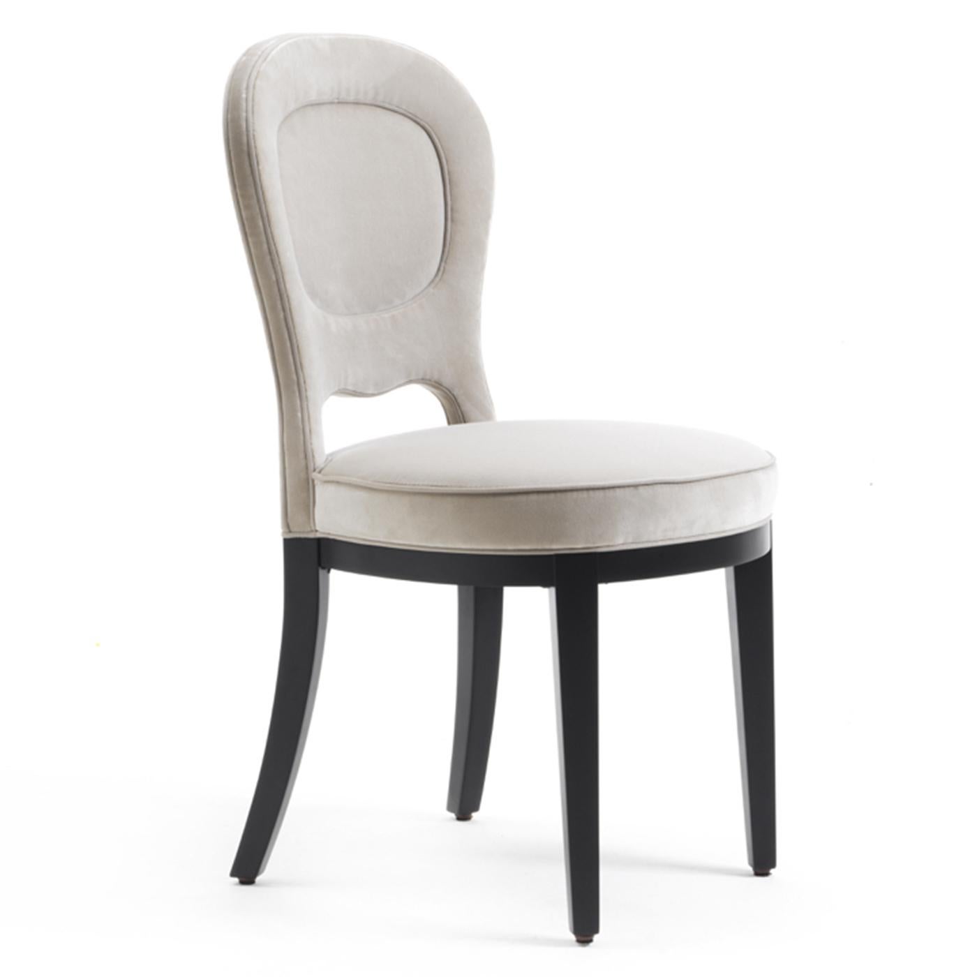 Part of the Gilda collection, this elegant chair is a versatile addition to any home, either in a classic dining room or behind a modern desk, this chair will imbue the space with subtle charm and timeless allure. The visible structure is in solid