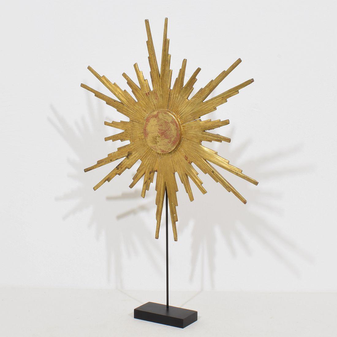 Beautiful weathered one of a kind piece. Giltwood baroque style sun, Italy, circa 1800-1900.
Weathered.
Measurement includes the wooden base.