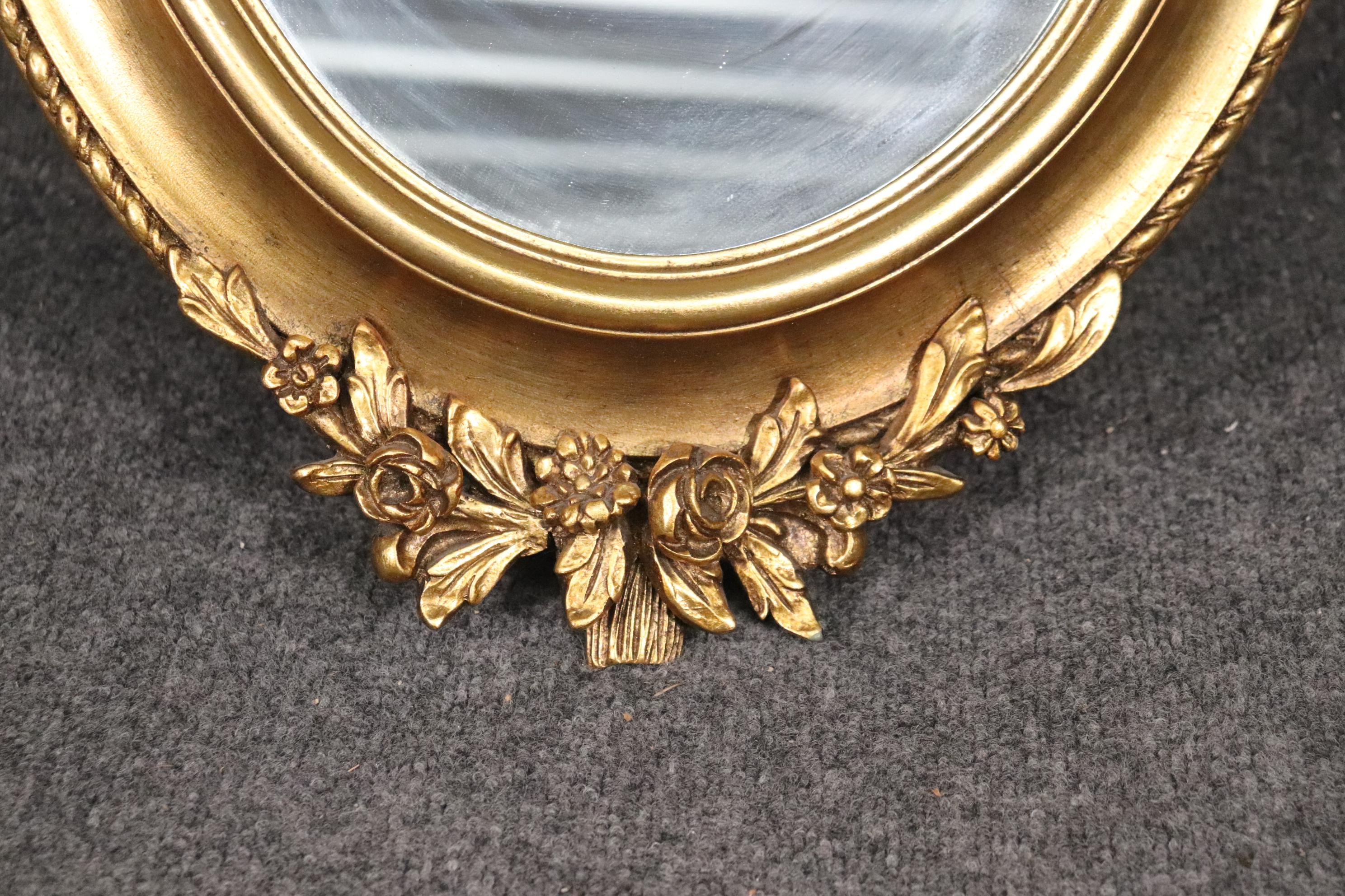 Unknown Gilded Adams Style Oval Mirror with Decorative Elements