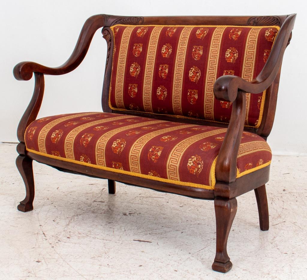 Gilded Age mahogany wood settee from the turn-of-the-century in the 