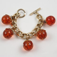 Gilded Aluminum and Prystal Orangeade Bakelite Beads Charm Bracelet