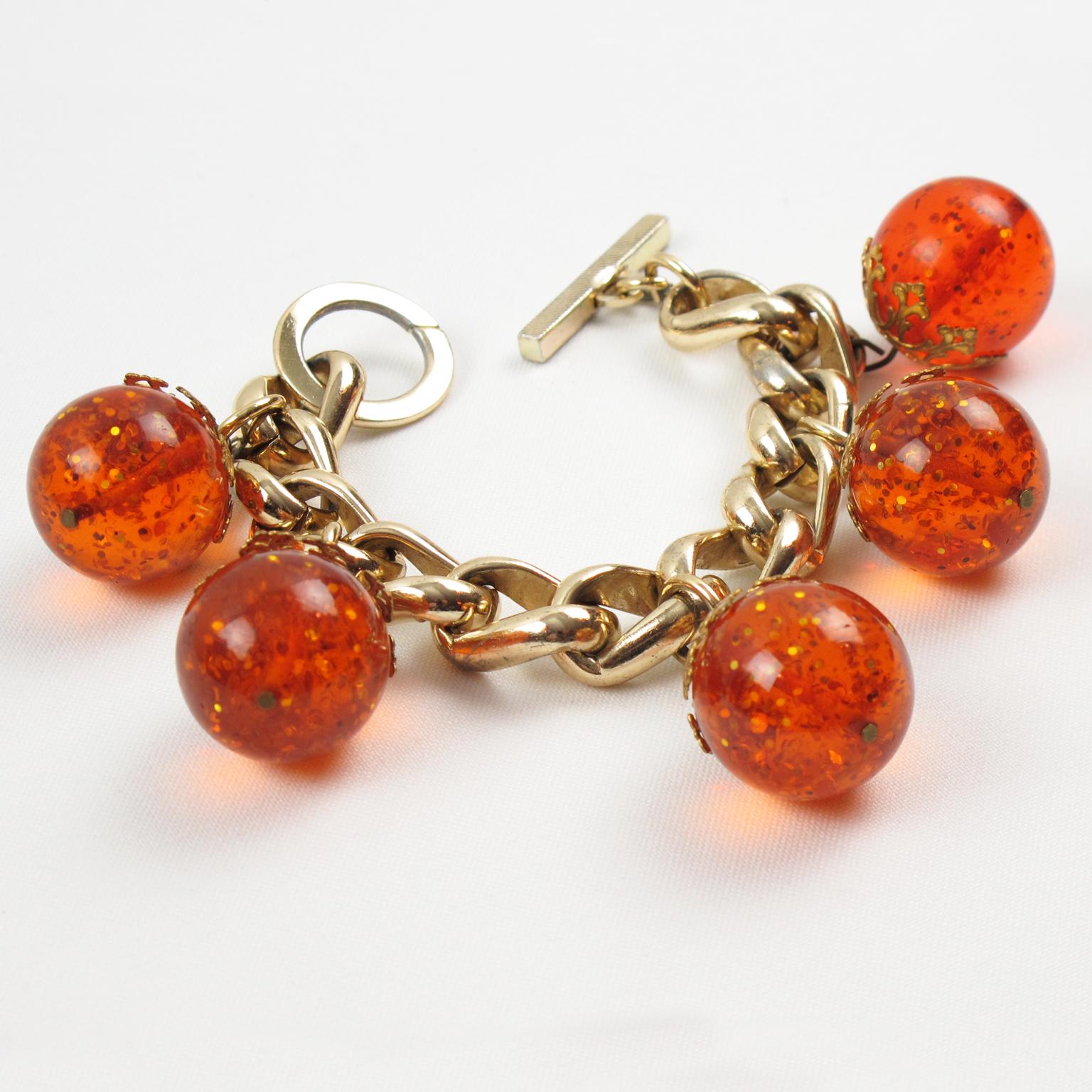 Art Deco Gilded Aluminum and Prystal Orangeade Bakelite Beads Charm Bracelet For Sale