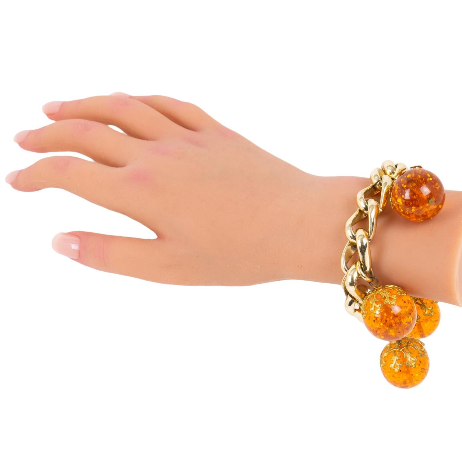 Gilded Aluminum and Prystal Orangeade Bakelite Beads Charm Bracelet For Sale 1