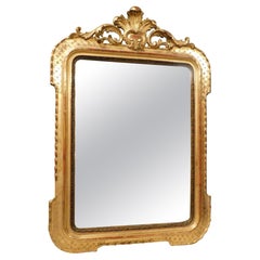 Miroir en bois doré et sculpté avec corniche, Italie
