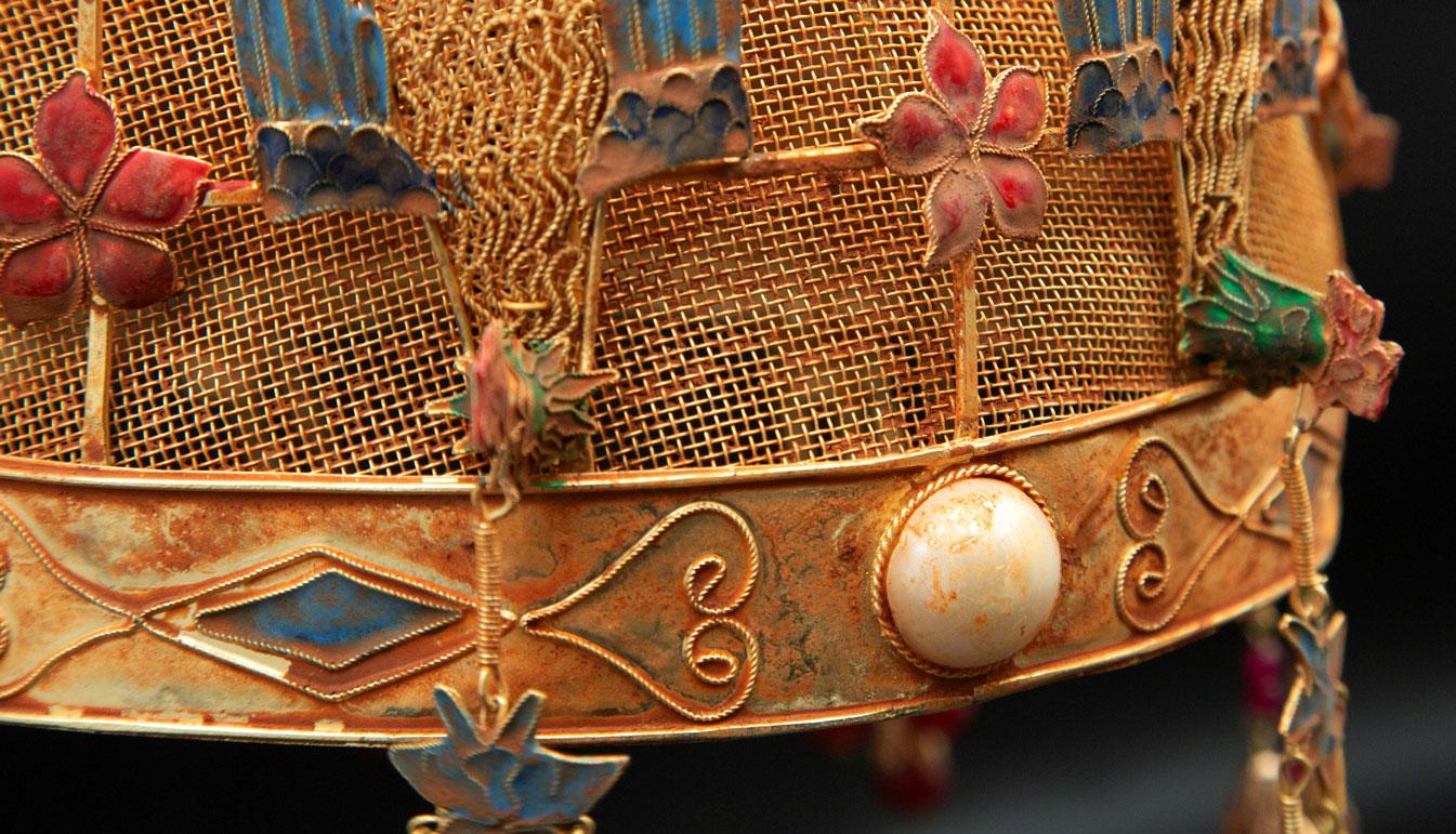 Chinese Opera Theatre headdress, birdcage. Chinese opera theatre headdress that is gilded with enamel birds flowers and decorated with pearls and natural stone. Mid-20th century, mounted on a custom black painted metal base. Measures: 14