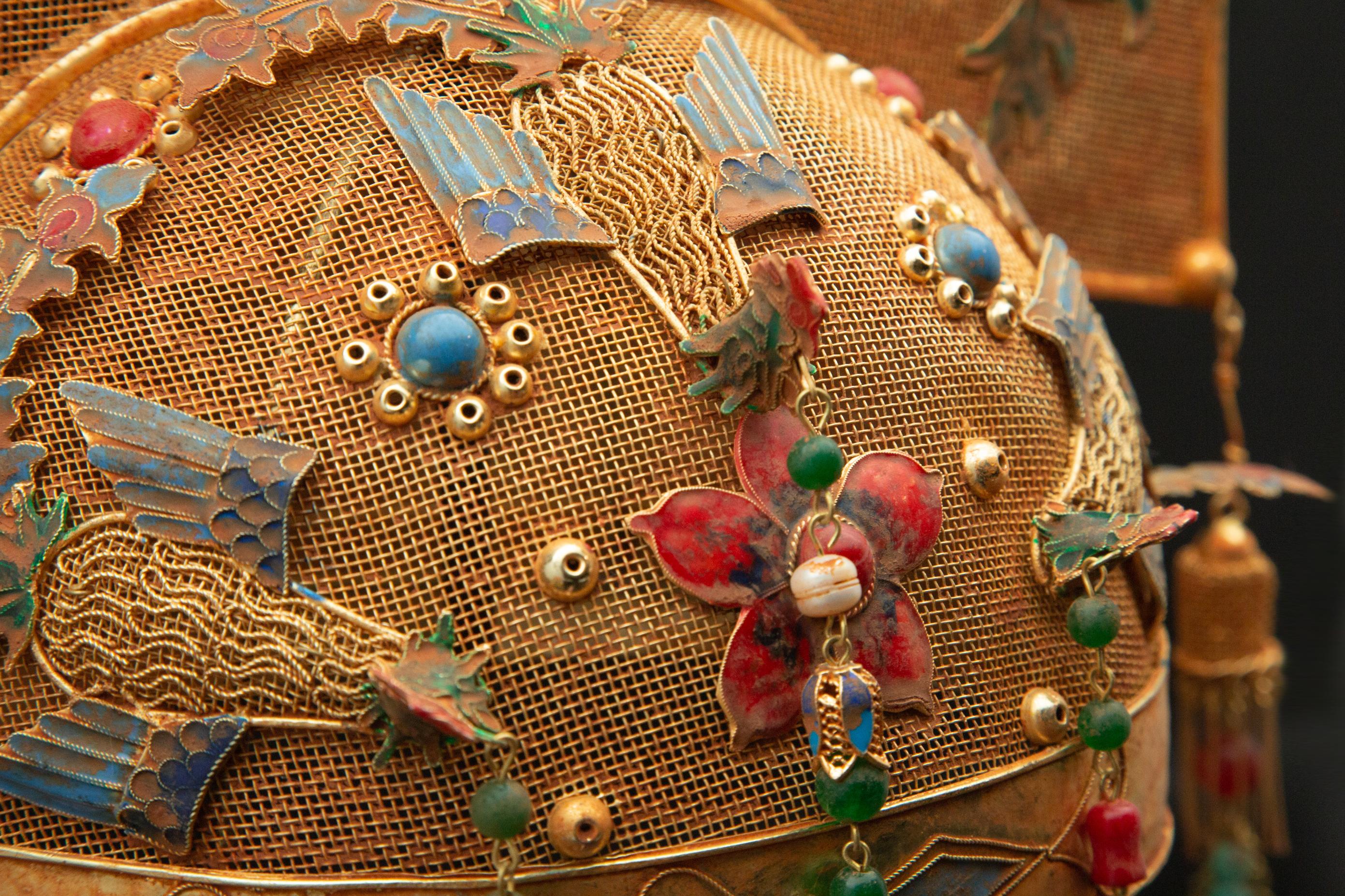 Chinese Opera Theatre Headdress, Rose. Chinese opera theatre headdress gilded and enamel with rose, pearls, turquoise flowers, beaded tassels, and red stones. Mid-20th century, mounted on a custom black painted metal base. 20.5
