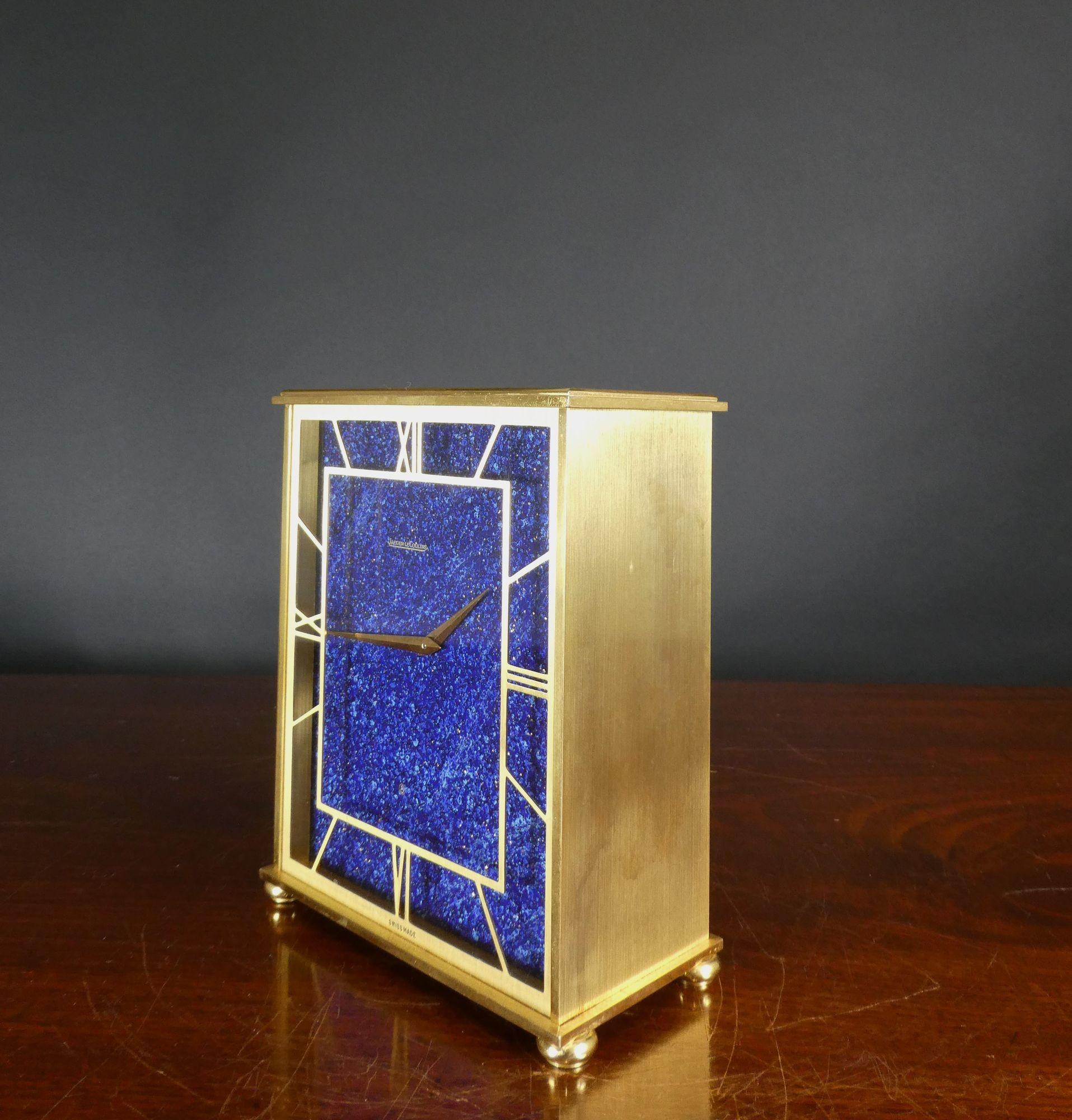 JAEGER LE COULTRE



Jaeger Le Coultre gilt table clock with Lapis Lazuli dial, Roman numerals signed ‘Jaeger Le Coultre’ and original gilded hands.
Rectangular, stepped brass case standing on bun feet. The bottom of the case numbered 545, opening