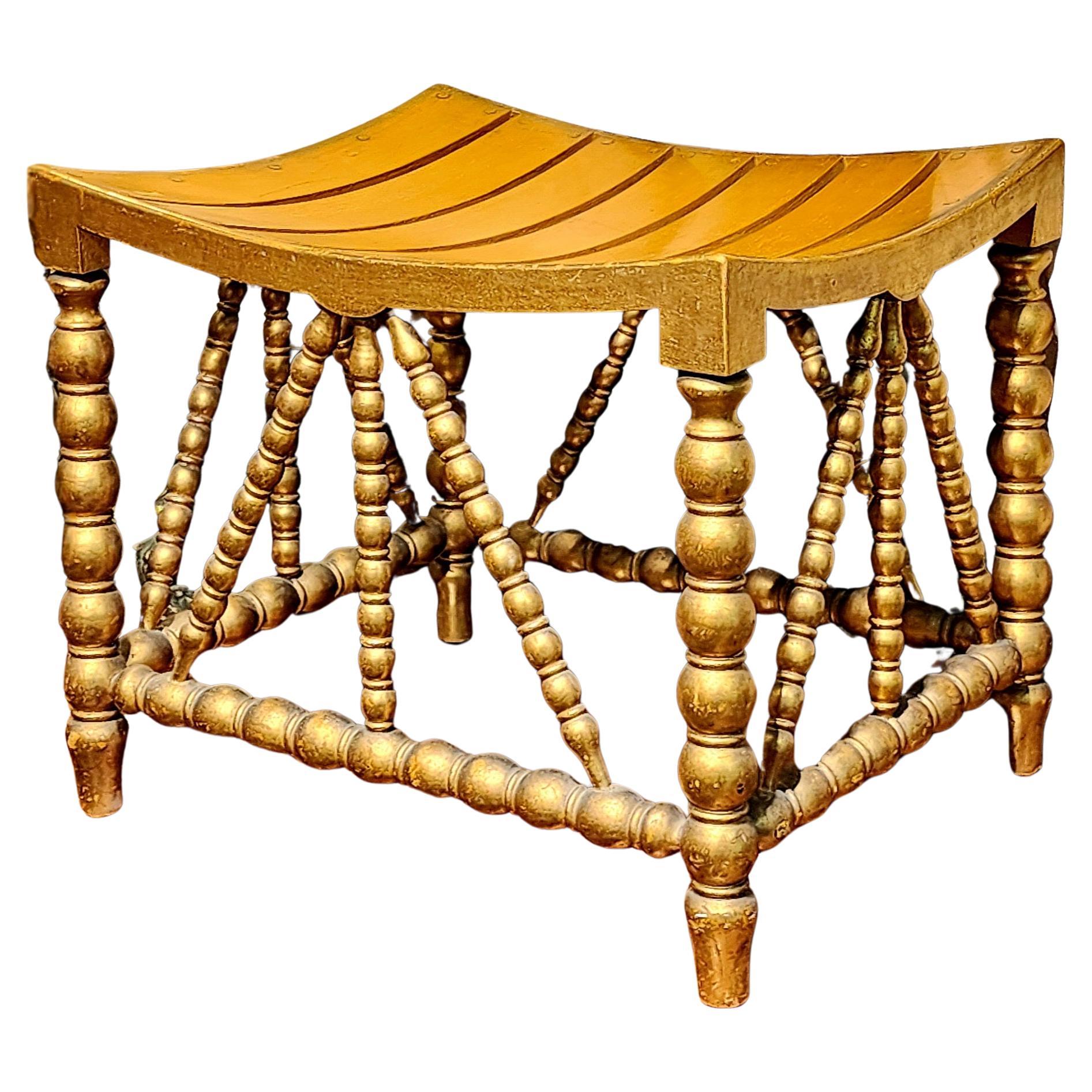 A sweet and stunning circa 1900 American gilded and painted Thebes stool. Exceptional quality, construction and design. Retaining the original ocher paint and gold gilded surface. The perfect patina to add that Touch of Elegance to any room. A