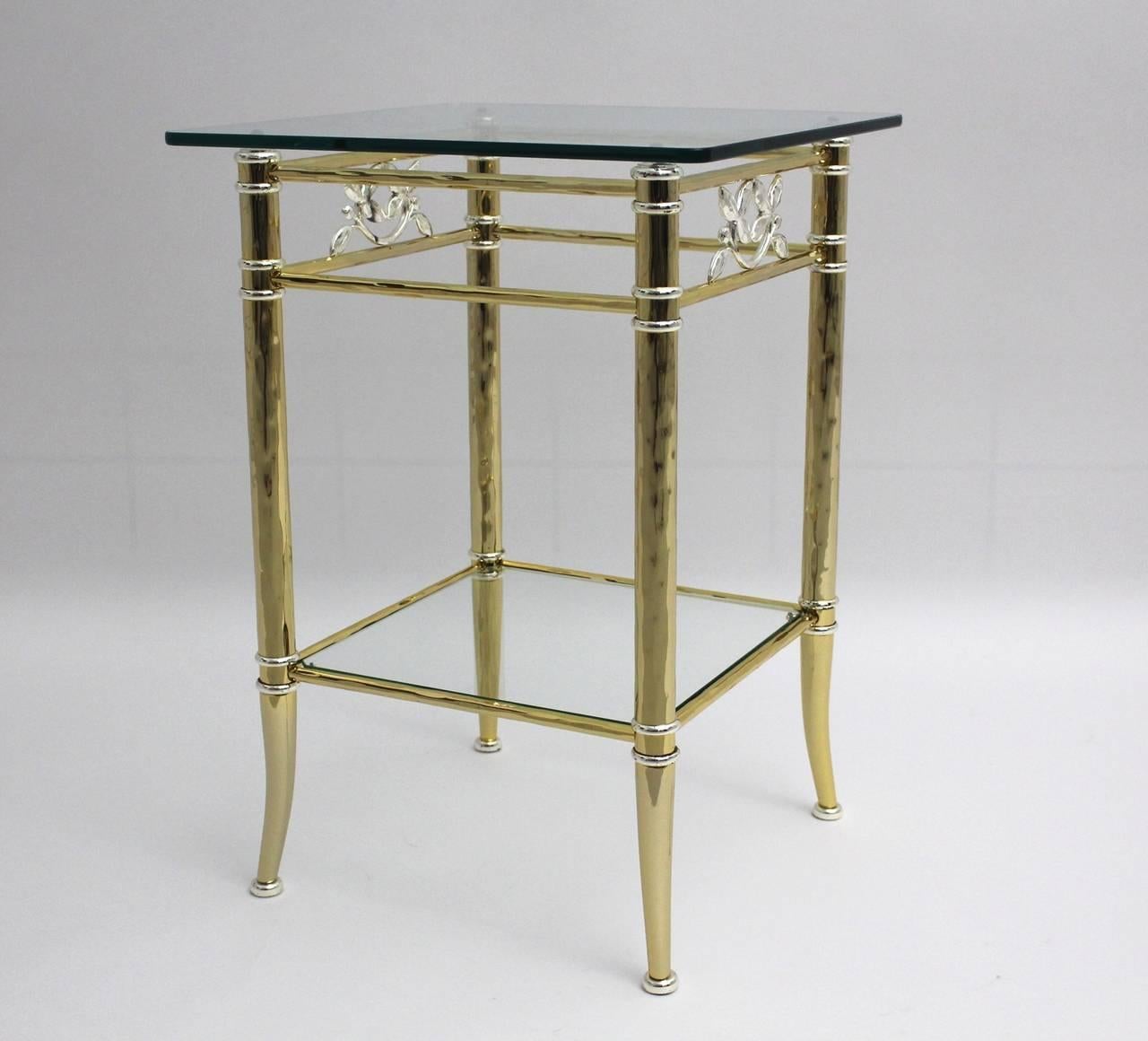 Extraordinary golden plated side table with silver plated flower elements and two glass plates.
Very good condition

all measures are approximate