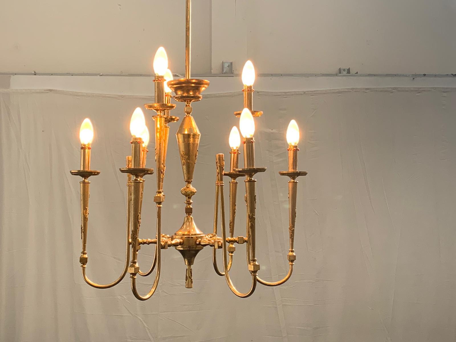 Pendant chandelier in worked and gilded brass. 8 arms, candle covers and fragments brought in gilded brass, inserts of similar gems Italy 50's.
Packaging with bubble wrap and cardboard boxes is included. If the wooden packaging is needed (fumigated
