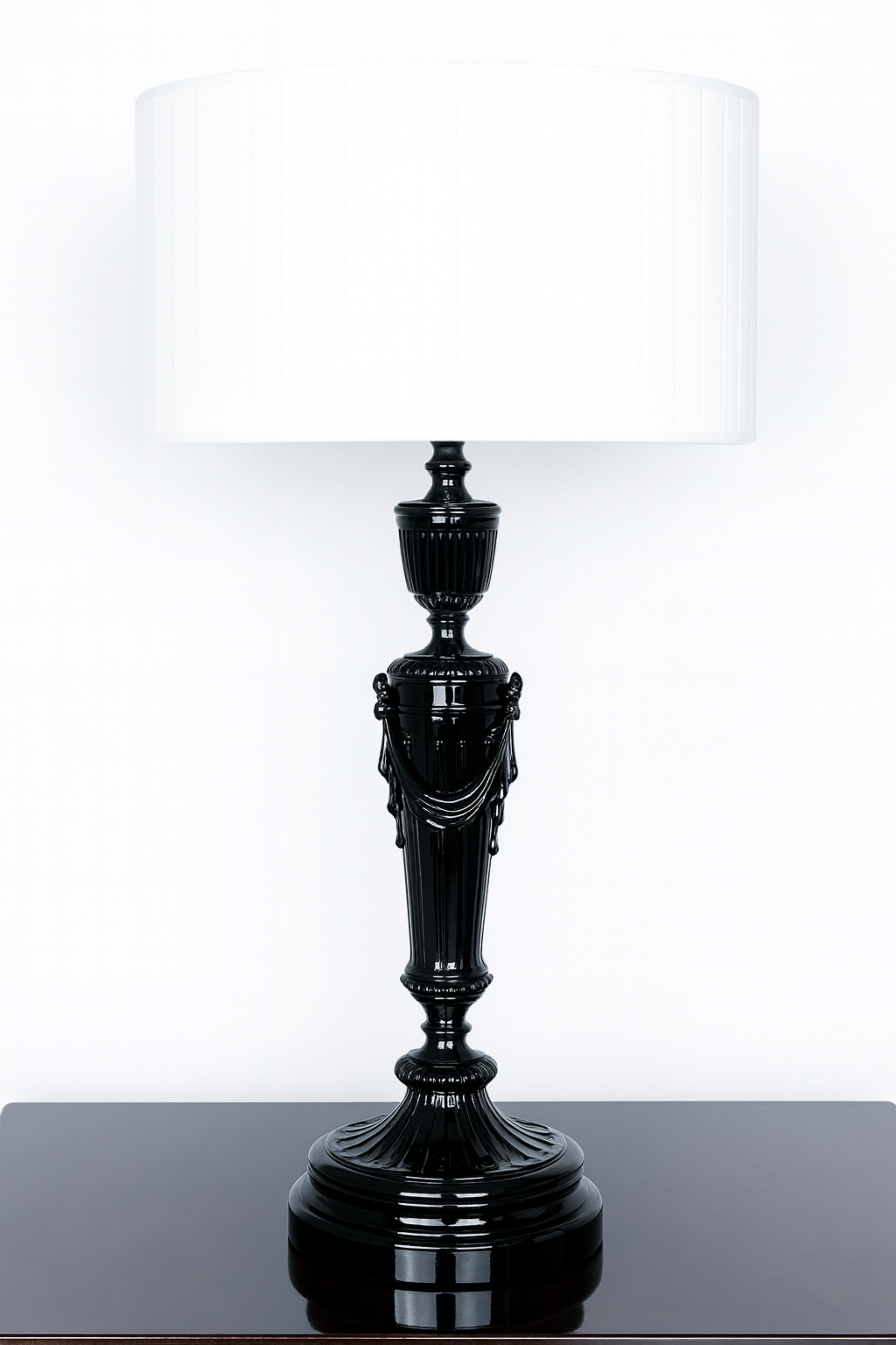 A refined late 19th-century french black lacquer refinished table lamp in gilded bronze, styled in the grandeur of the Napoleon III era. 

Recently rewired for modern use, it is sold without the lampshade shown in the photo.

Measuring 45 cm in