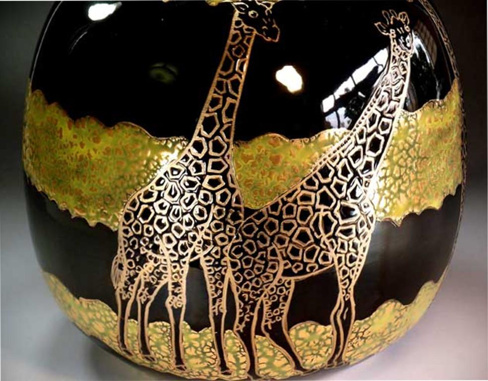 Exquisite contemporary Japanese decorative porcelain vase, hand painted in gold on a stunningly shaped ovoid body in black to create a transparent surface.  It is a masterpiece by widely acclaimed master porcelain artist in traditional patterns of