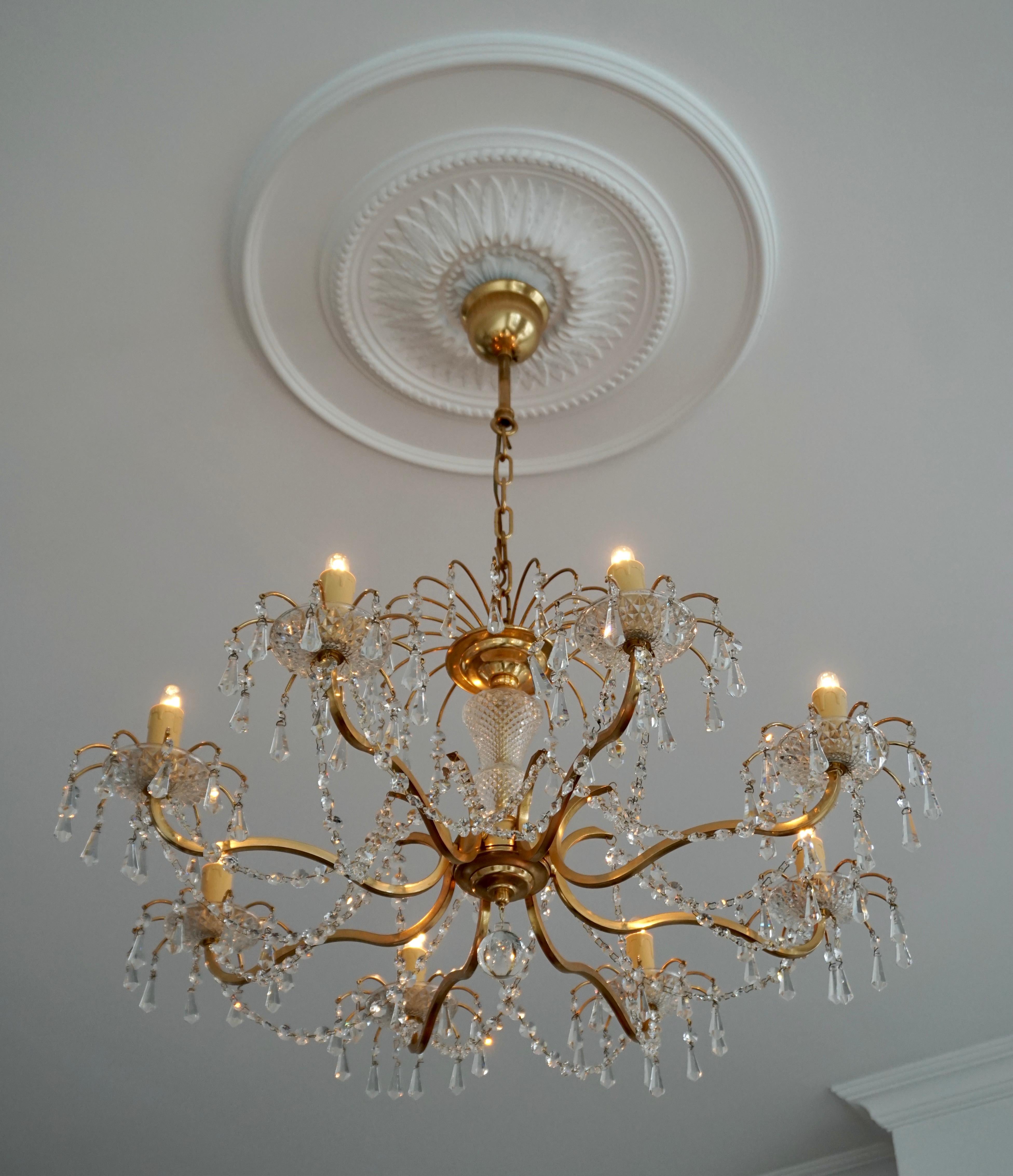 A fine eight-light chandelier having a bright gilded brass frame and cut crystal dressing. 

The light requires eight single E14 screw fit lightbulbs (45Watt max.) LED compatible.

Measures: 
Diameter 73 cm. 
Height fixture 37 cm. 
Total