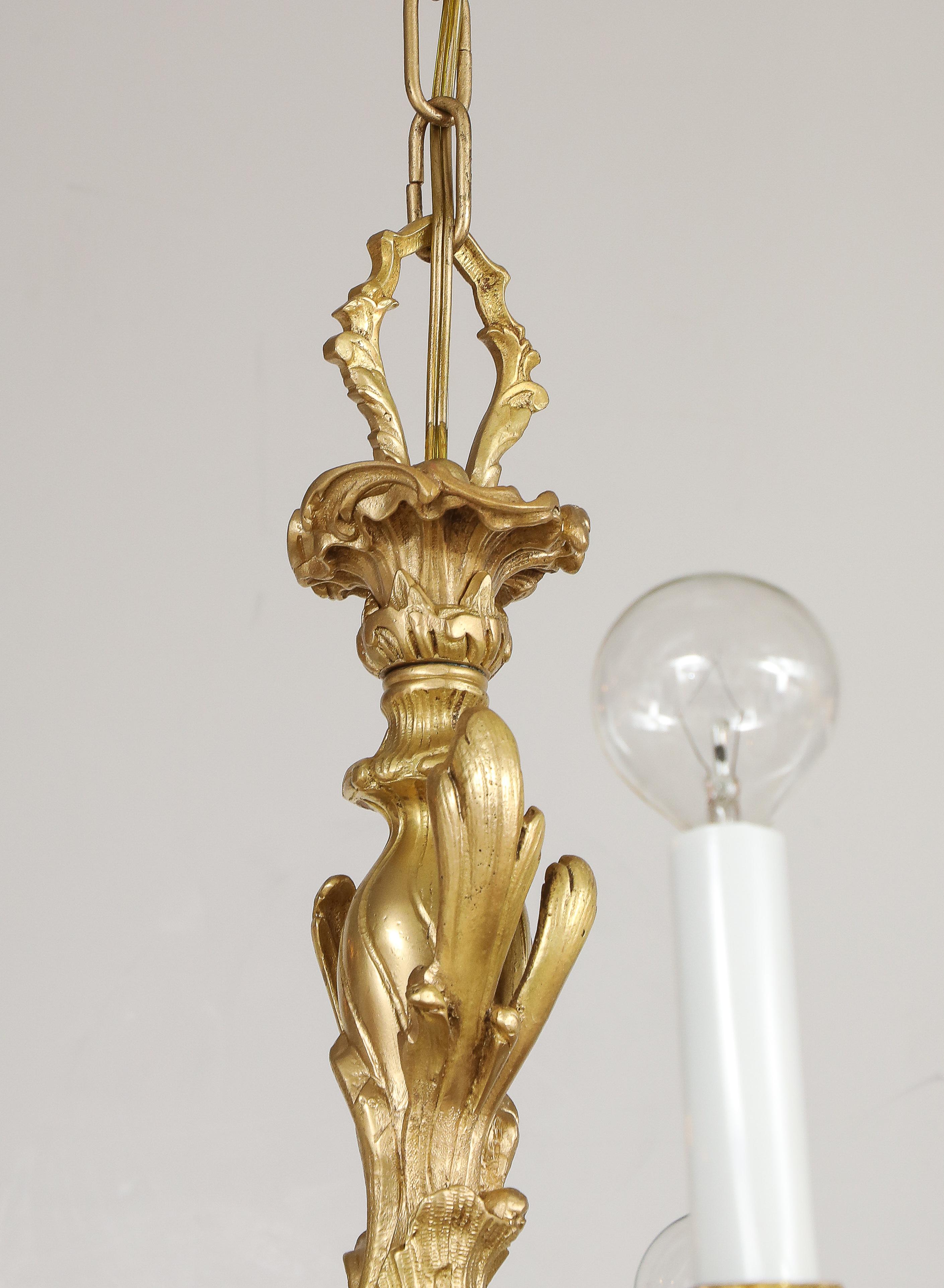 Lampadario in stile Reggenza a 10 bracci in bronzo dorato proveniente dalla Spagna in vendita 8