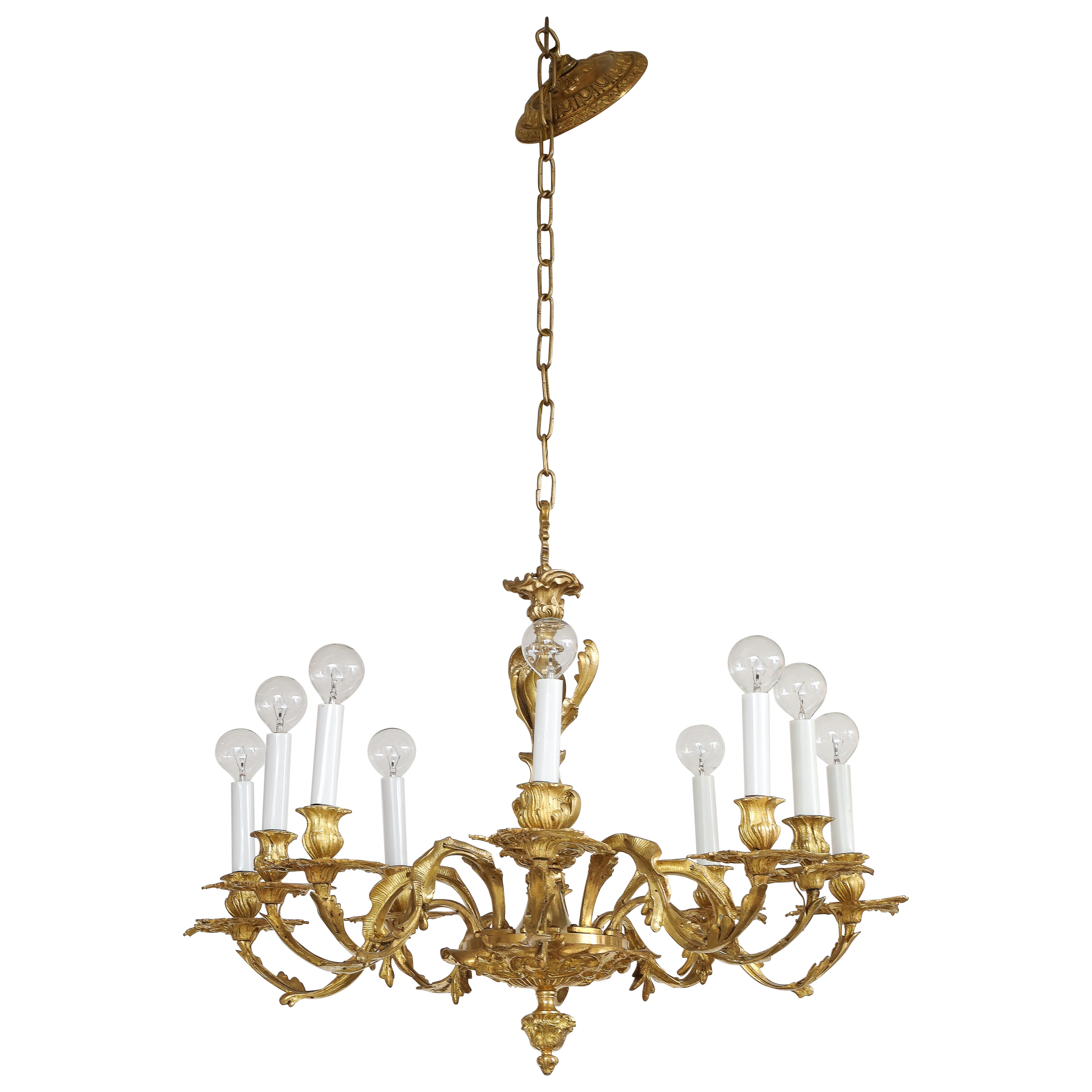 Lampadario in stile Reggenza a 10 bracci in bronzo dorato proveniente dalla Spagna in vendita