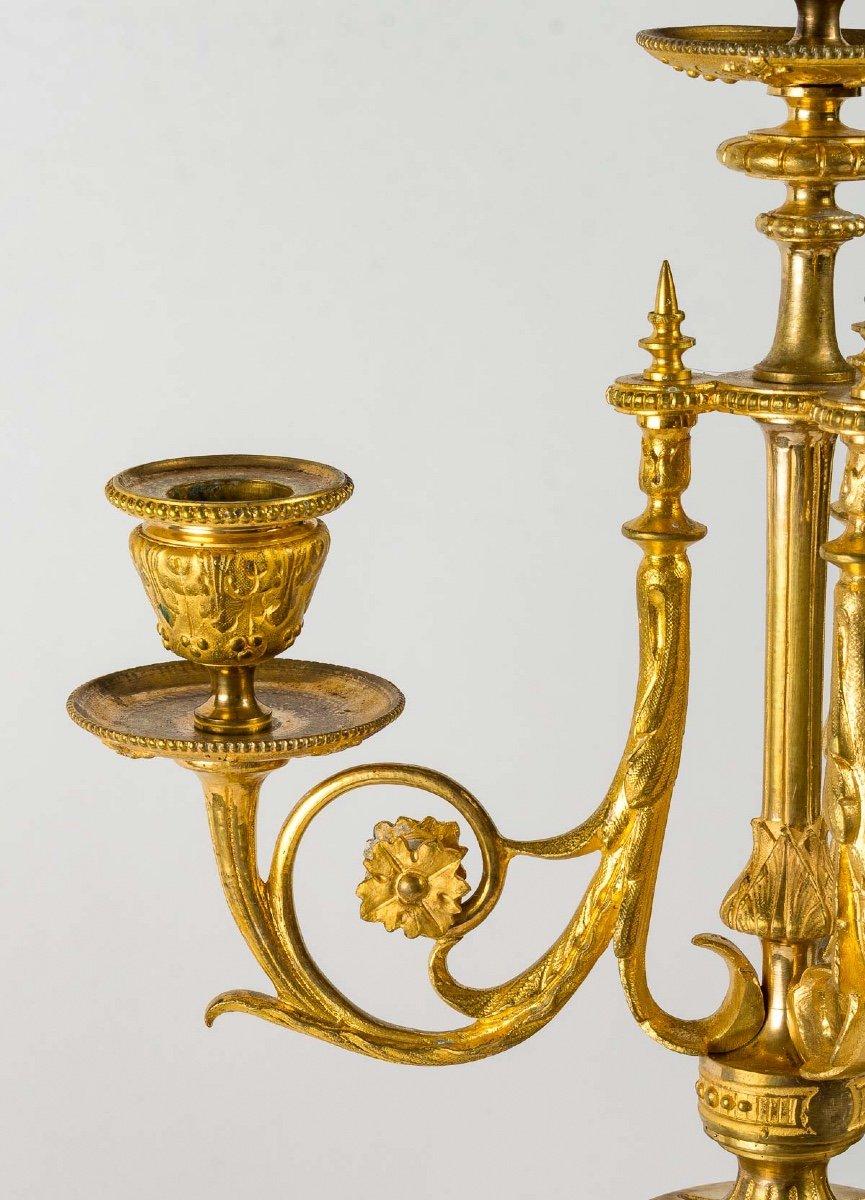 Gilded bronze and blue marble mantel set, composed of a clock and a pair of five arms candelabras.
Napoleon III period, late 19th century
In perfect condition.
Clock H : 44 cm / W : 31 cm / D : 14 cm
Candelabras H : 47 cm / W : 14 cm / D : 14 cm.
