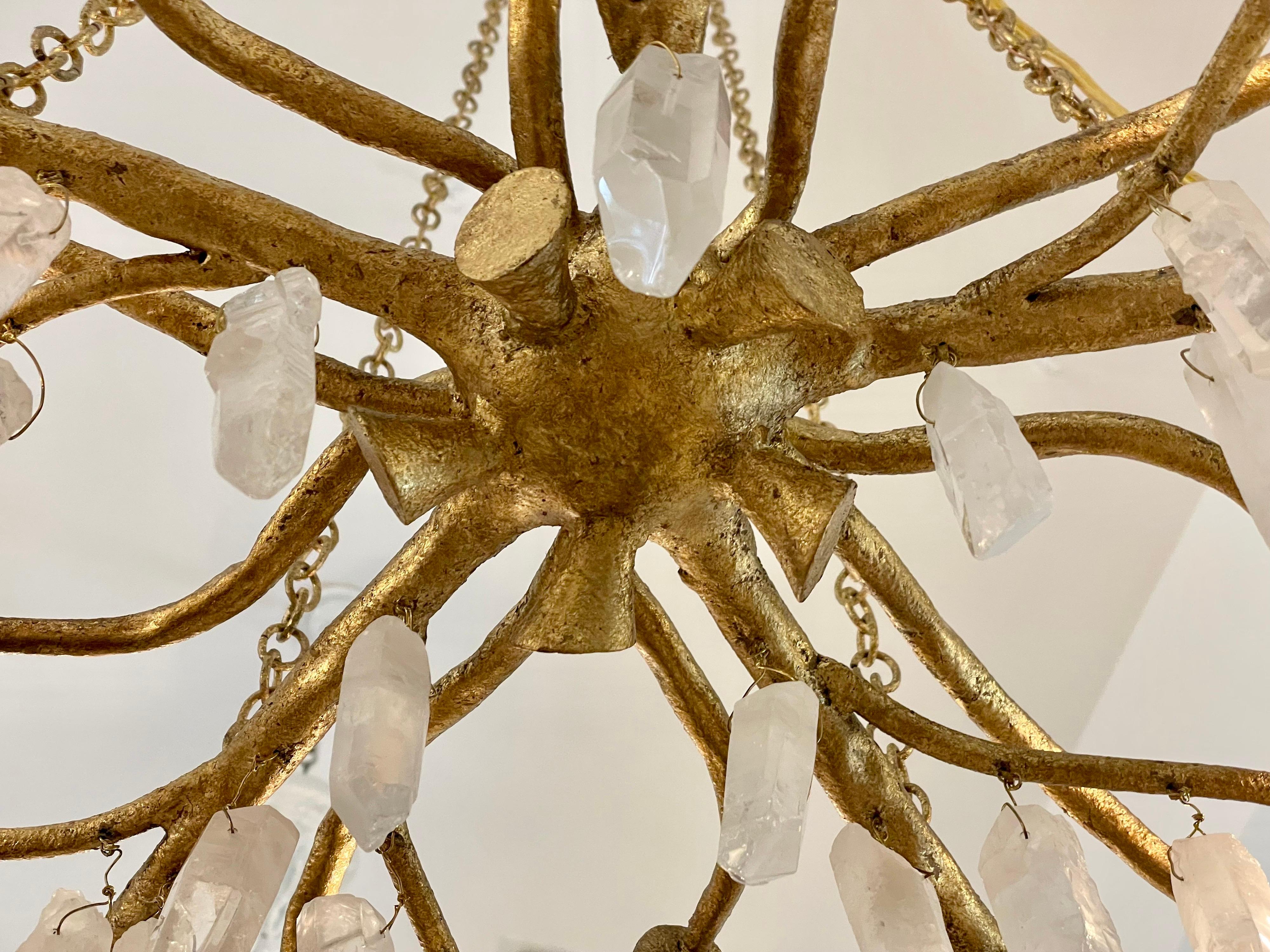 This is a fairly new chandelier but was sourced from an amazing Southampton beachfront estate. Made from gilt metal in branches style and natural rock crystal clusters (175+ pieces) - makes it an enchanting and very natural fixture (10 candelabra