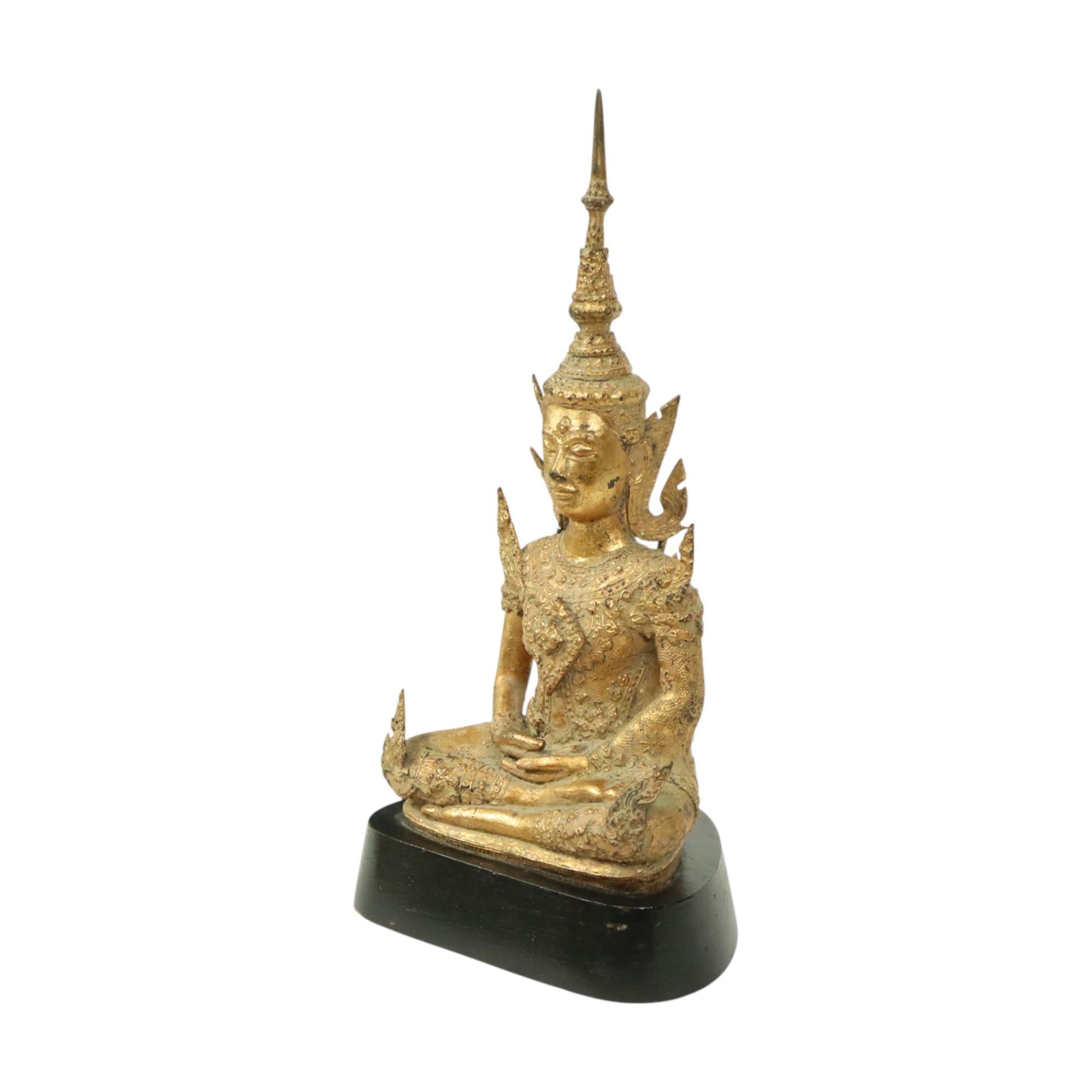 A magnificent bronze Buddha in Rattanakosin style, mounted on a black lacquered wooden base. This is the Dhyana Mudra Buddha, or meditating Buddha. This object originates from Thailand, circa 1900.

Dhyana Mudra, the meditation gesture, depicts both