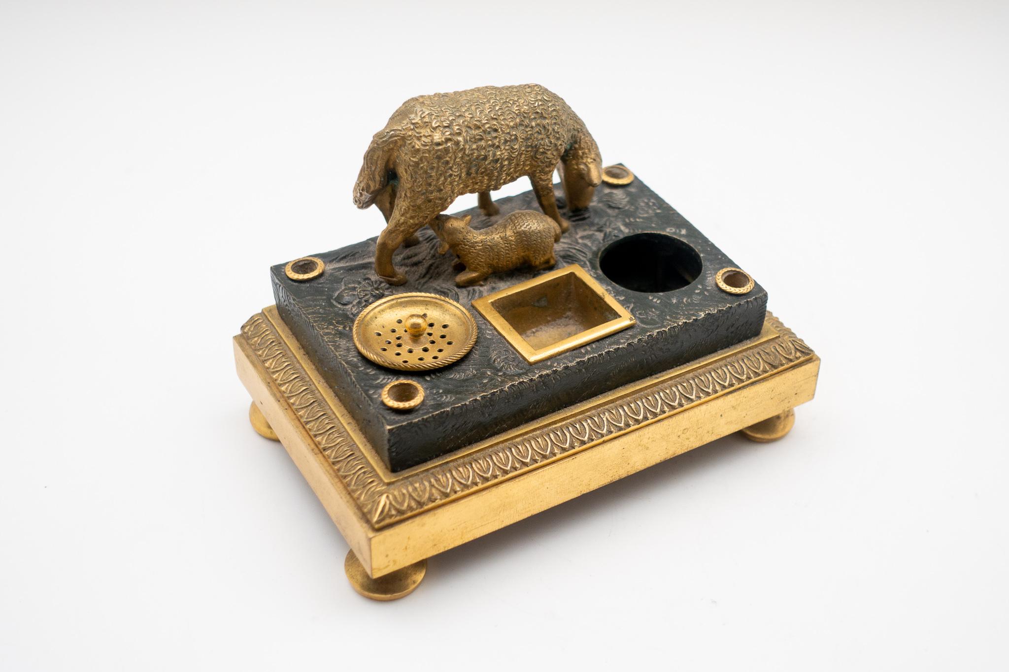 Beautiful 19th century gilded bronze French inkwell of a sheep and its suckling lamb. Ceramic inkwell liner missing on one side.