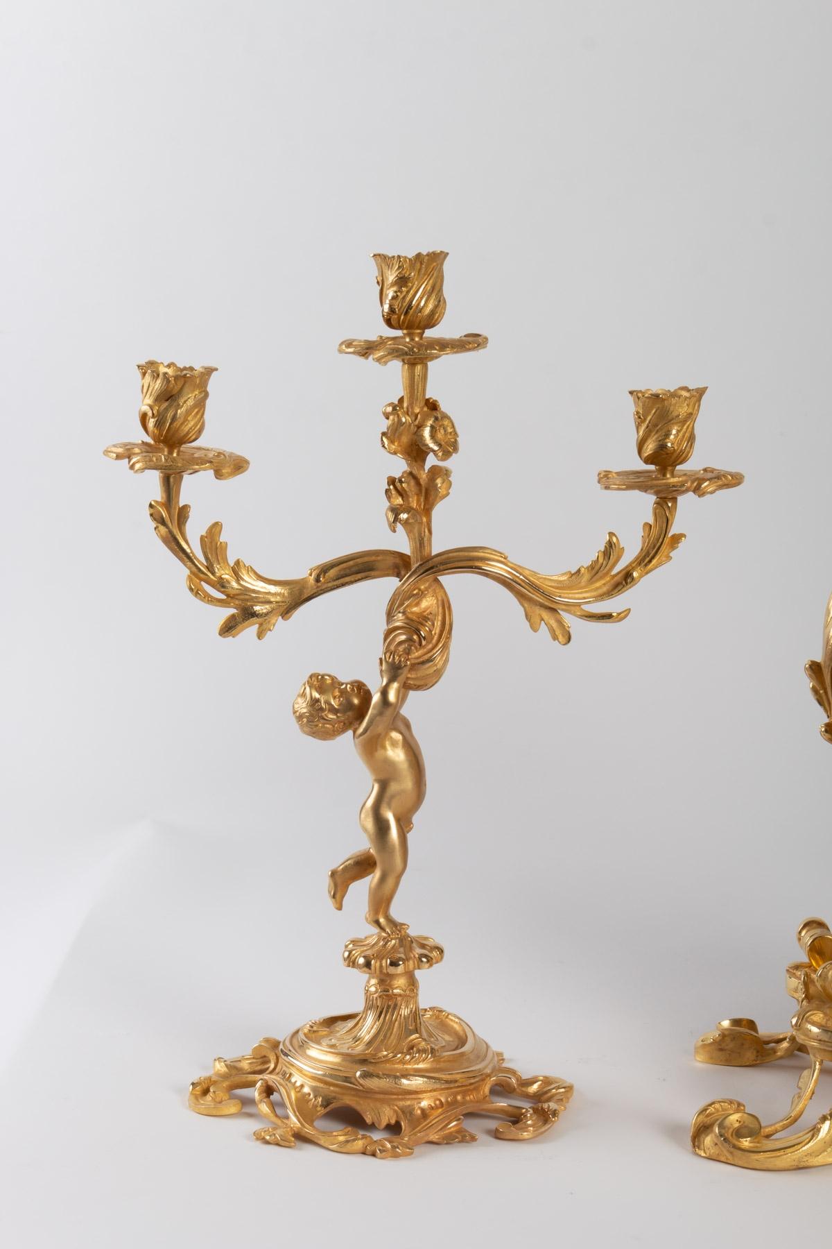 Louis XV style mantel set in gilded bronze, beautiful quality of chasing and gilding,
Late 19th century period, Napoleon III
Measures: Pendulum: Height 40cm, length 30cm
Candelabras: Height 40cm, length 18cm.