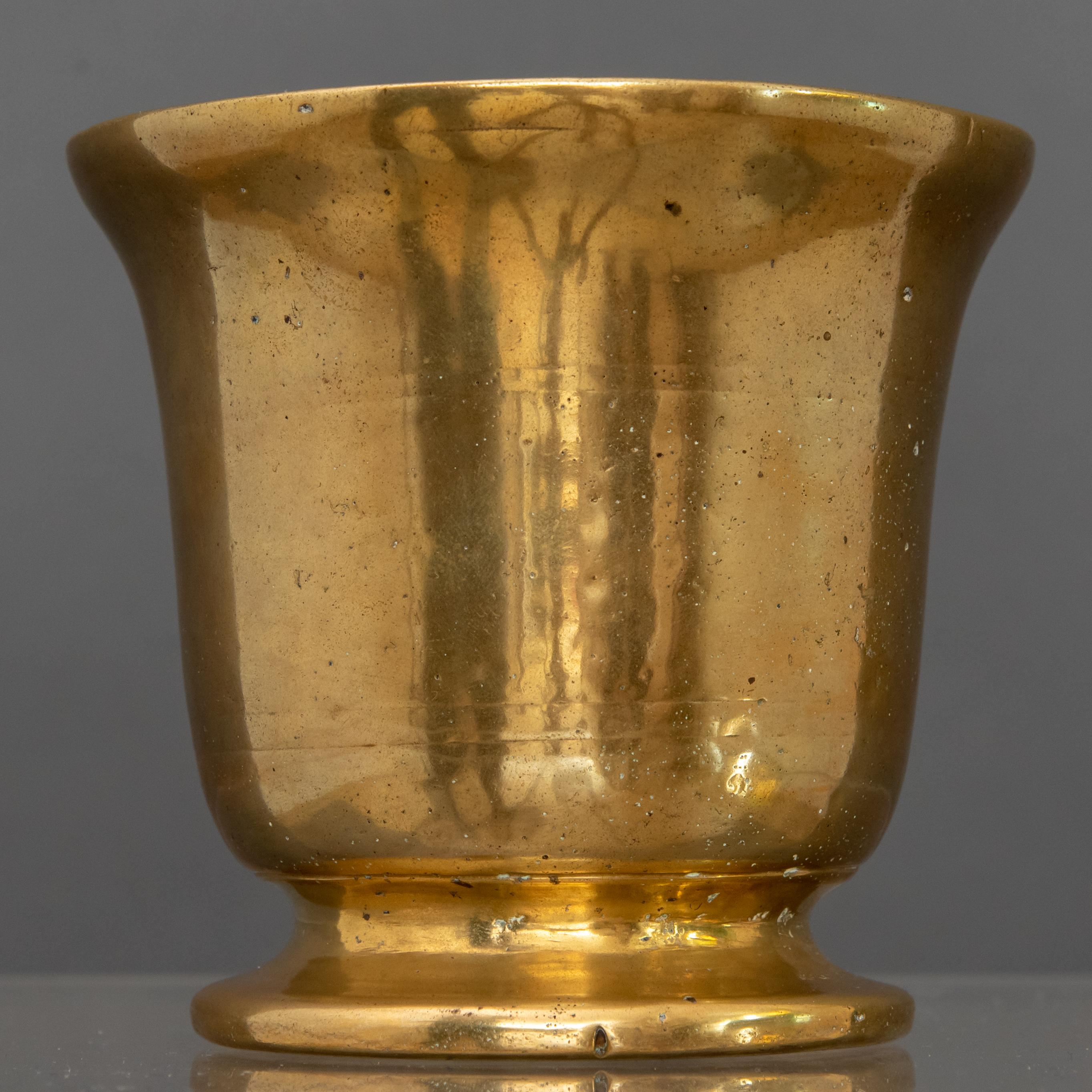 gilded mortar and pestle