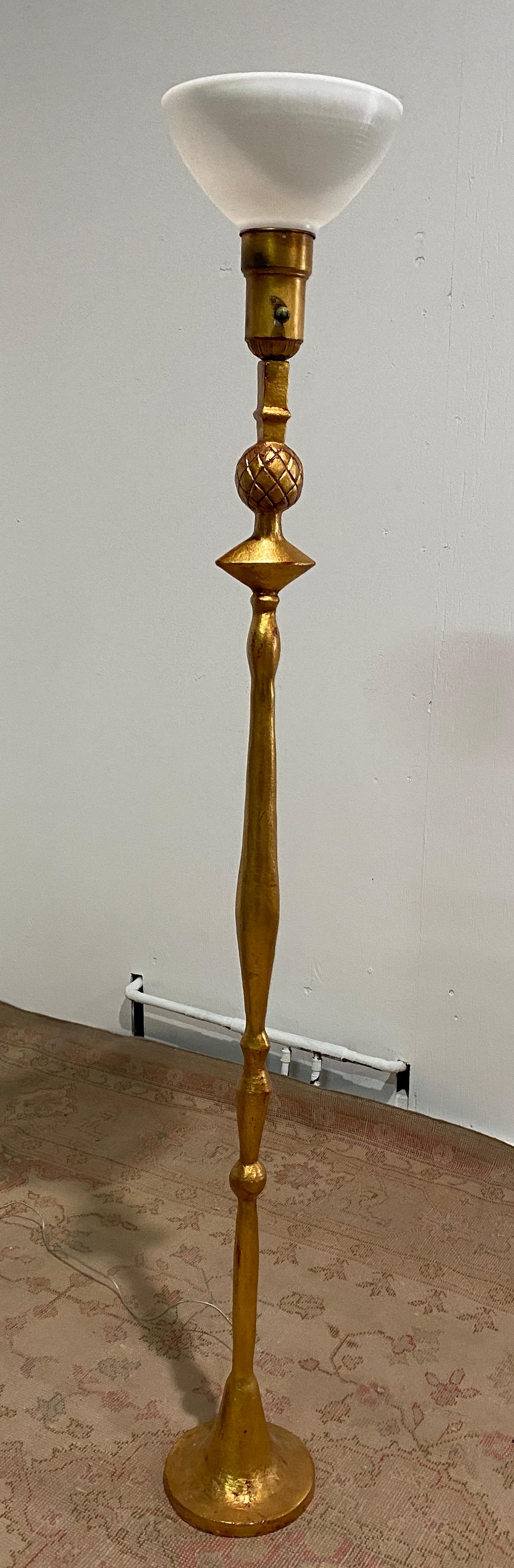 This tall Torchere was produced by Frances Elkins 
The gilding has a lovely aged patina with some loss. The casting is crisp and
true to the original design. Spotty loss to surface, some wear. General marks,
scratches rubbing etc. All shown on