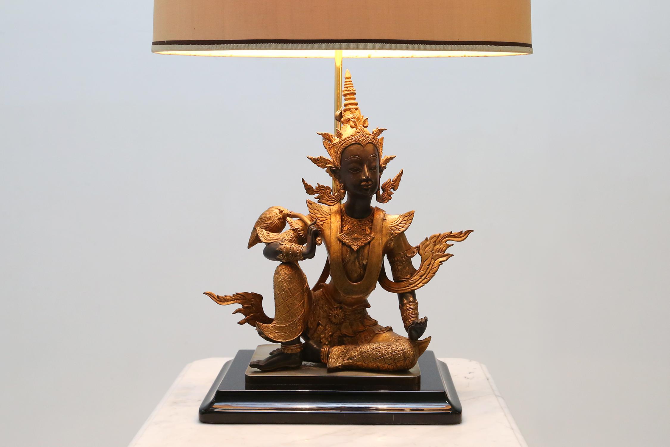 Gilded bronze seated Buddha table lamp of the Rattanakosin period.

The figure is made of gilded bronze and has some nice details in the clothing's and accessories.