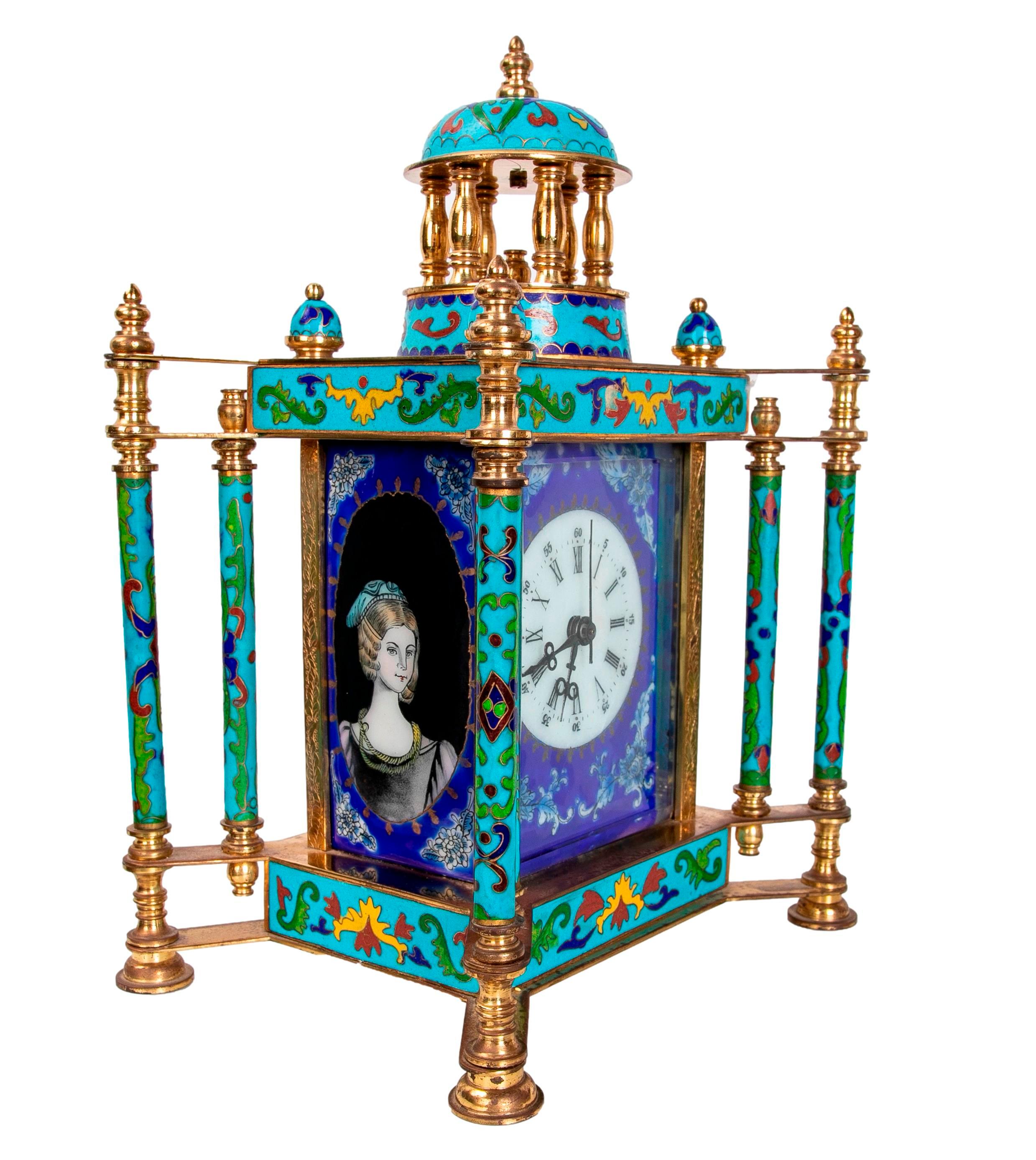 Gilded bronze table clock with cloisonne and porcelain decoration.