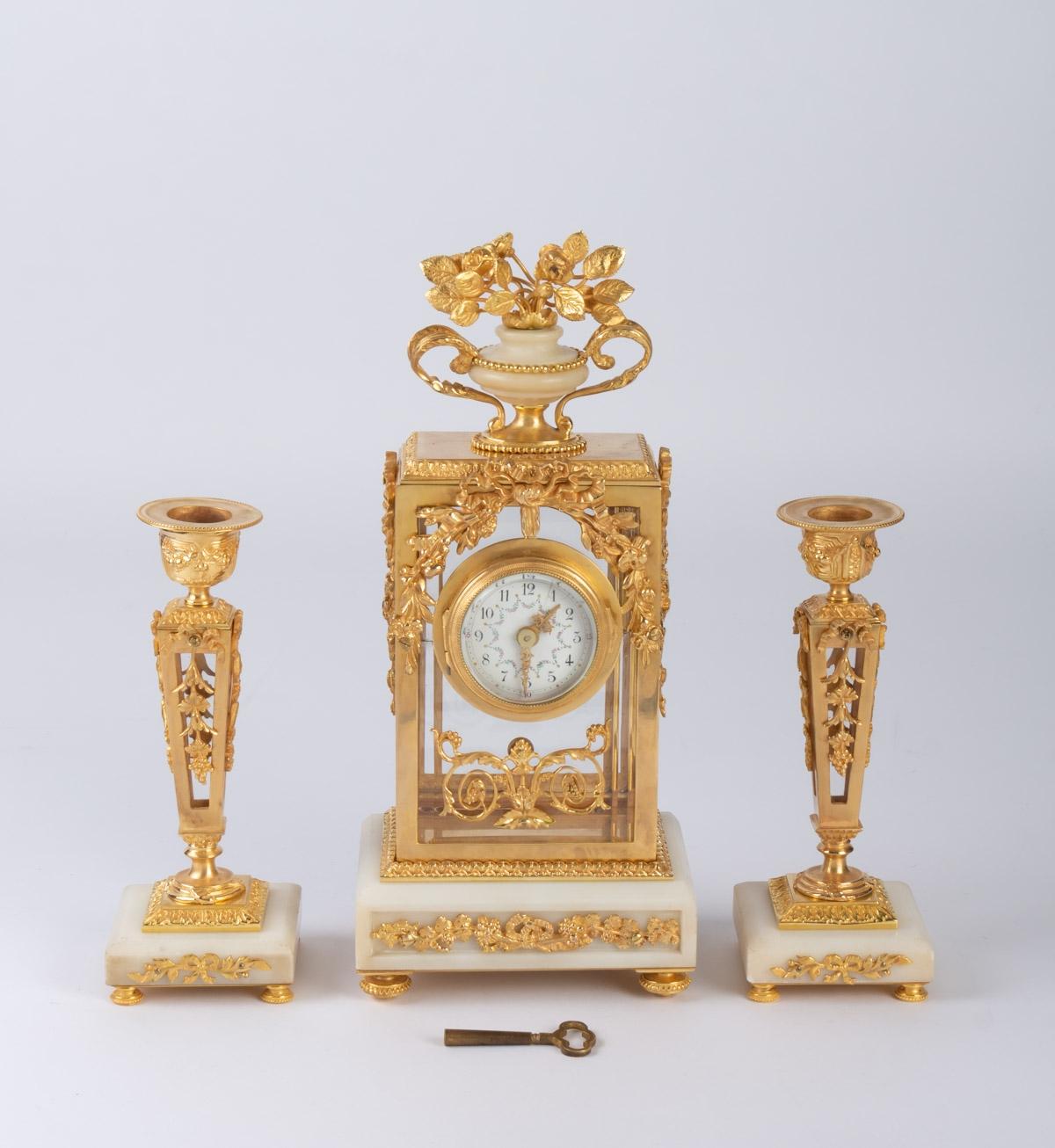 Small Napoleon III style bronze and white marble mantel trim,
Louis XVI style, 19th century period.
Measures: Candelabra: W 10cm, H 20cm, D 10cm
Clock: W 16cm, H 32cm, D 11cm.