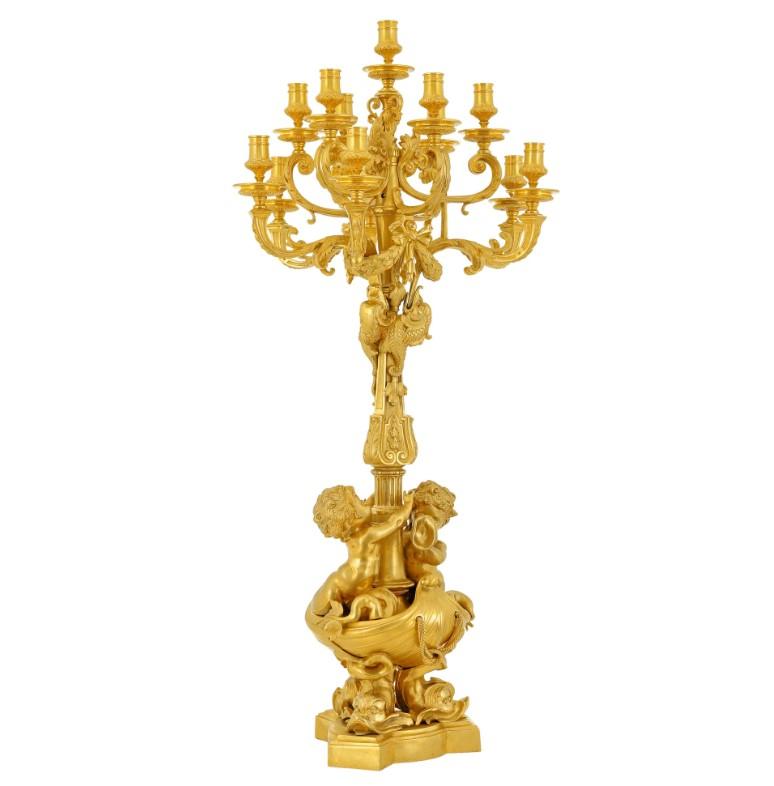 Magnificent  Gilt Bronze Candelabra - A Thirteen-Light Masterpiece inspired by Second Empire

This exceptional candelabra, boasting an impressive thirteen elegantly curved arms of light, is a testament to the artistry of its time. Meticulously